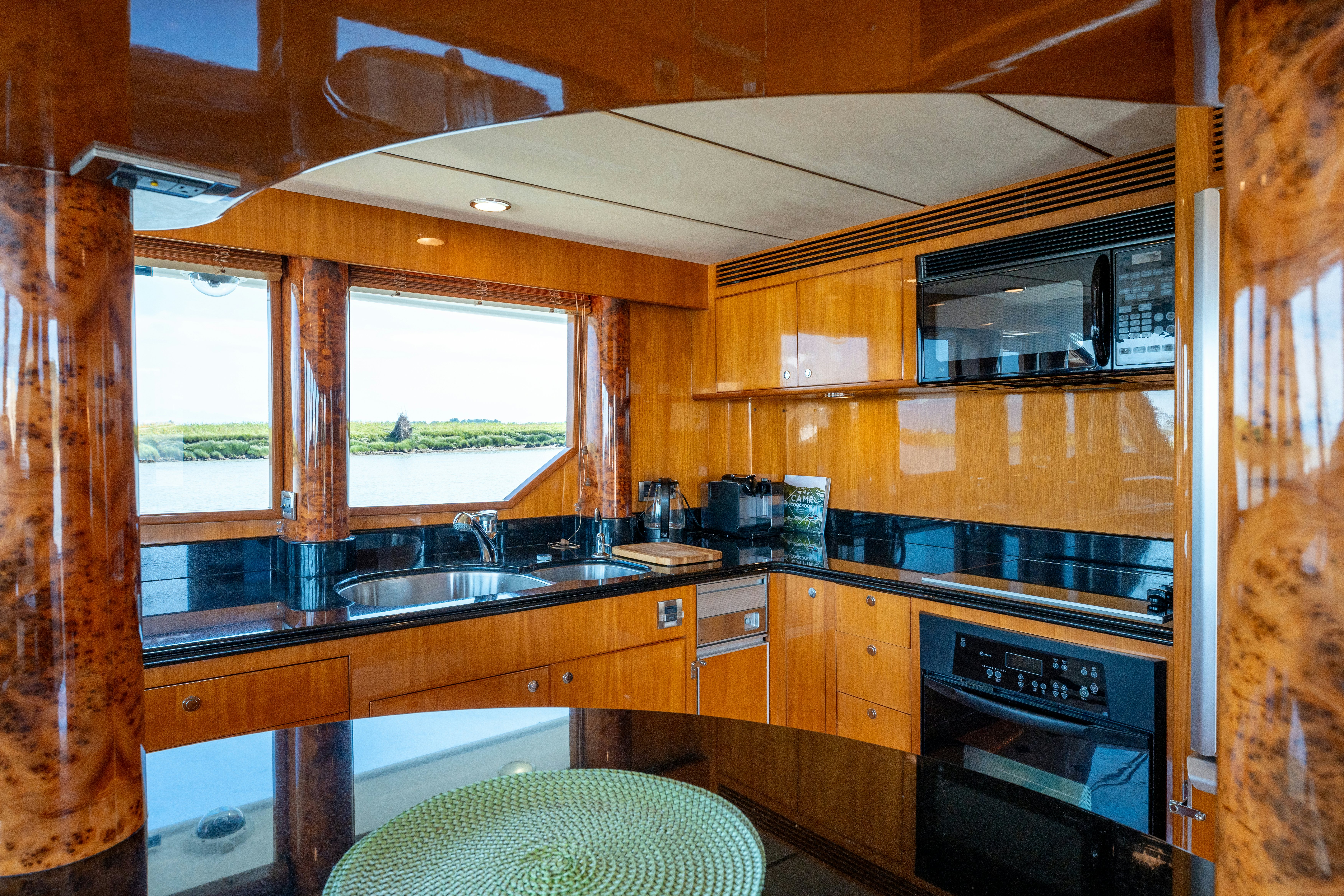 a kitchen with wooden cabinets aboard MEMORY BANK Yacht for Sale