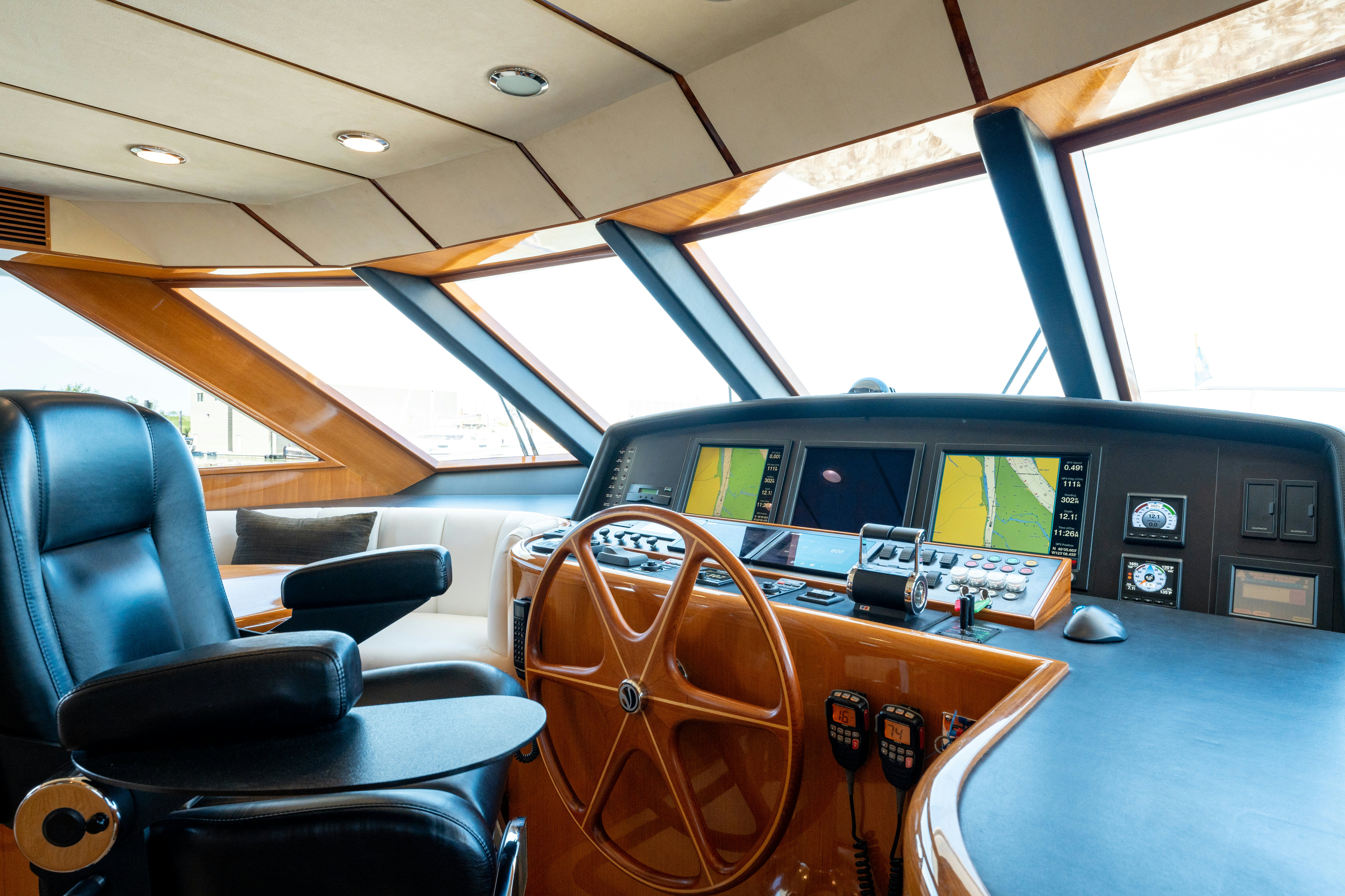 inside of a vehicle with seats and a steering wheel and a seat aboard MEMORY BANK Yacht for Sale