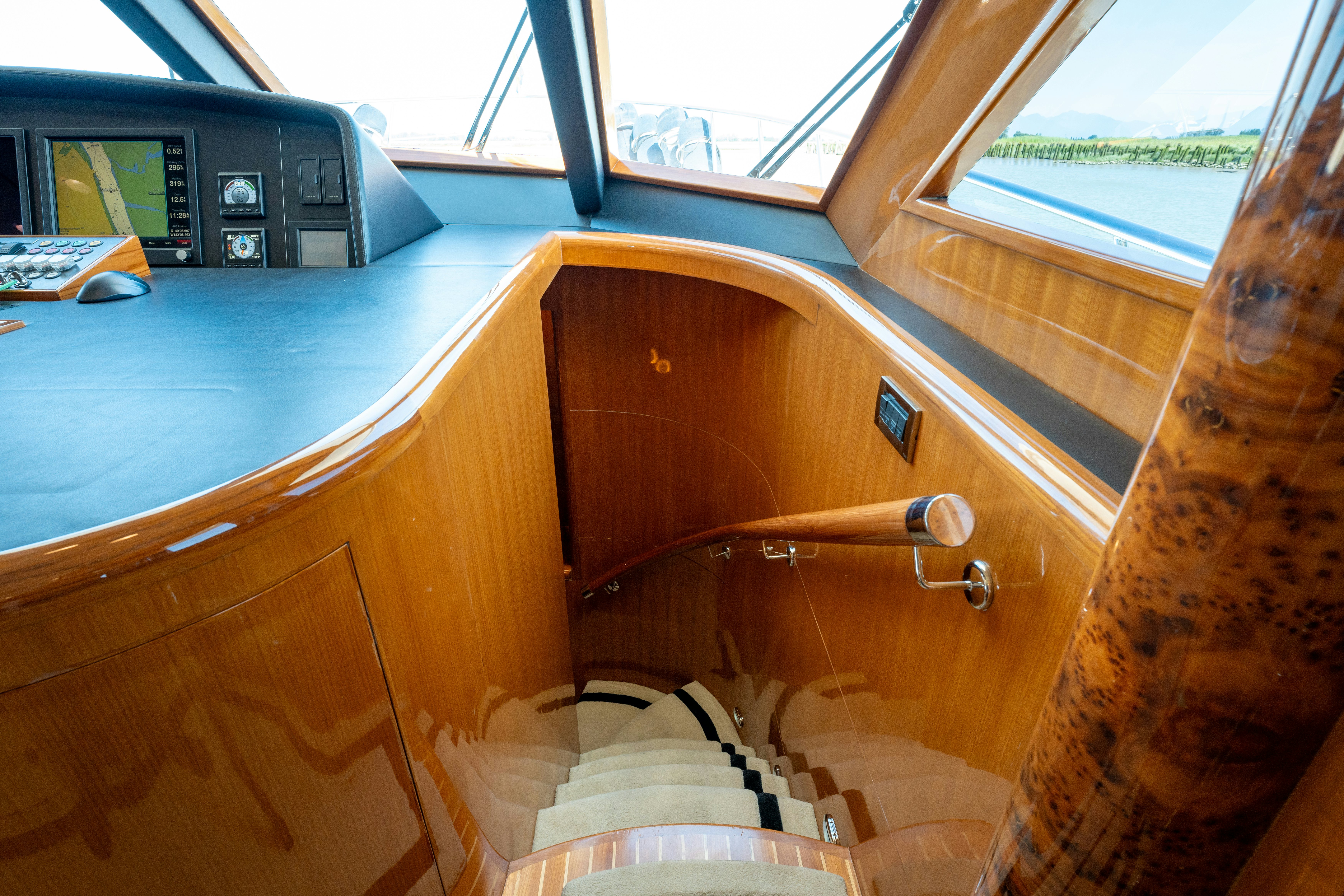 a wooden boat with a wooden steering wheel aboard MEMORY BANK Yacht for Sale