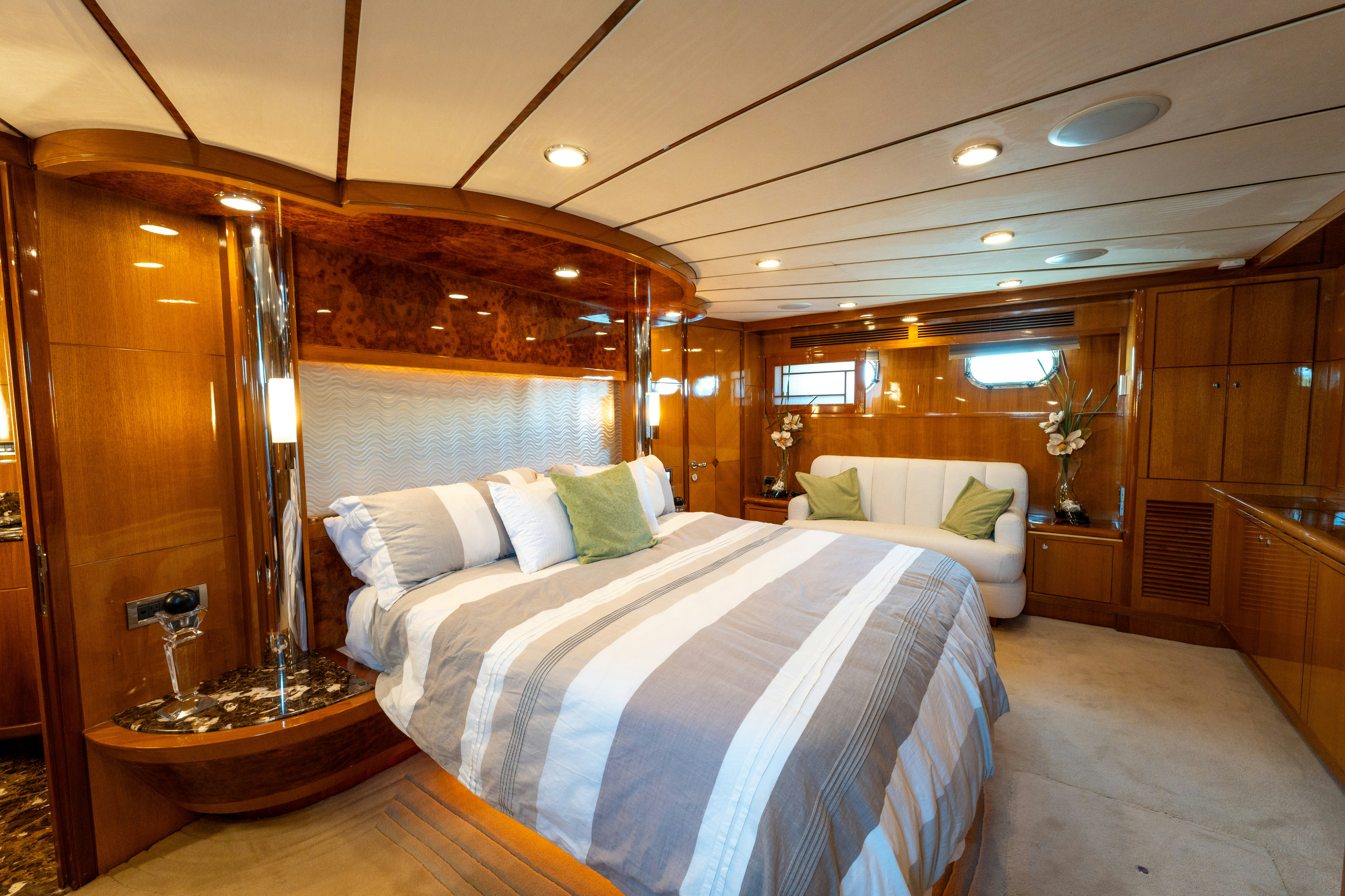 a room with a bed and a mirror aboard MEMORY BANK Yacht for Sale