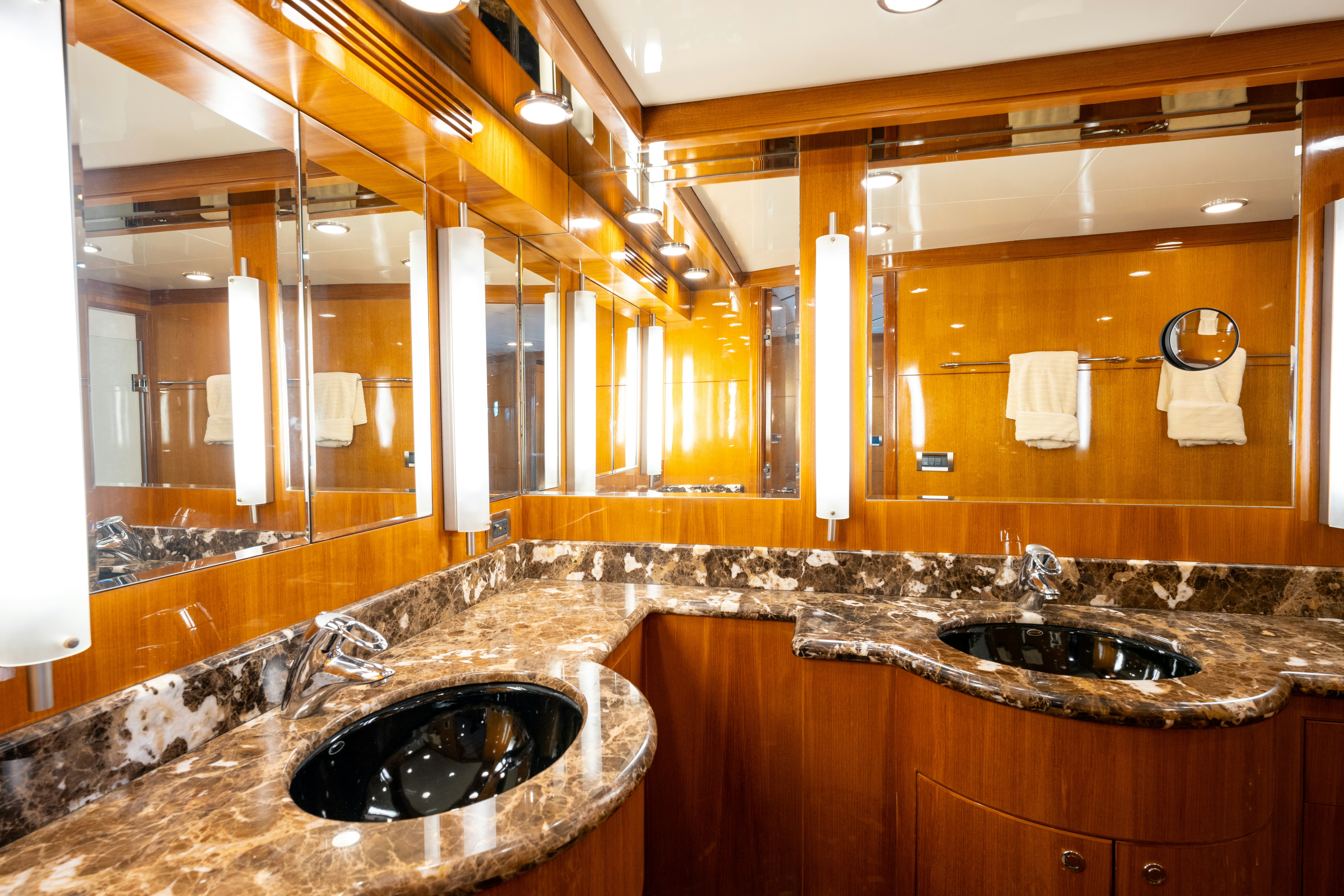 a bathroom with sinks and mirrors aboard MEMORY BANK Yacht for Sale