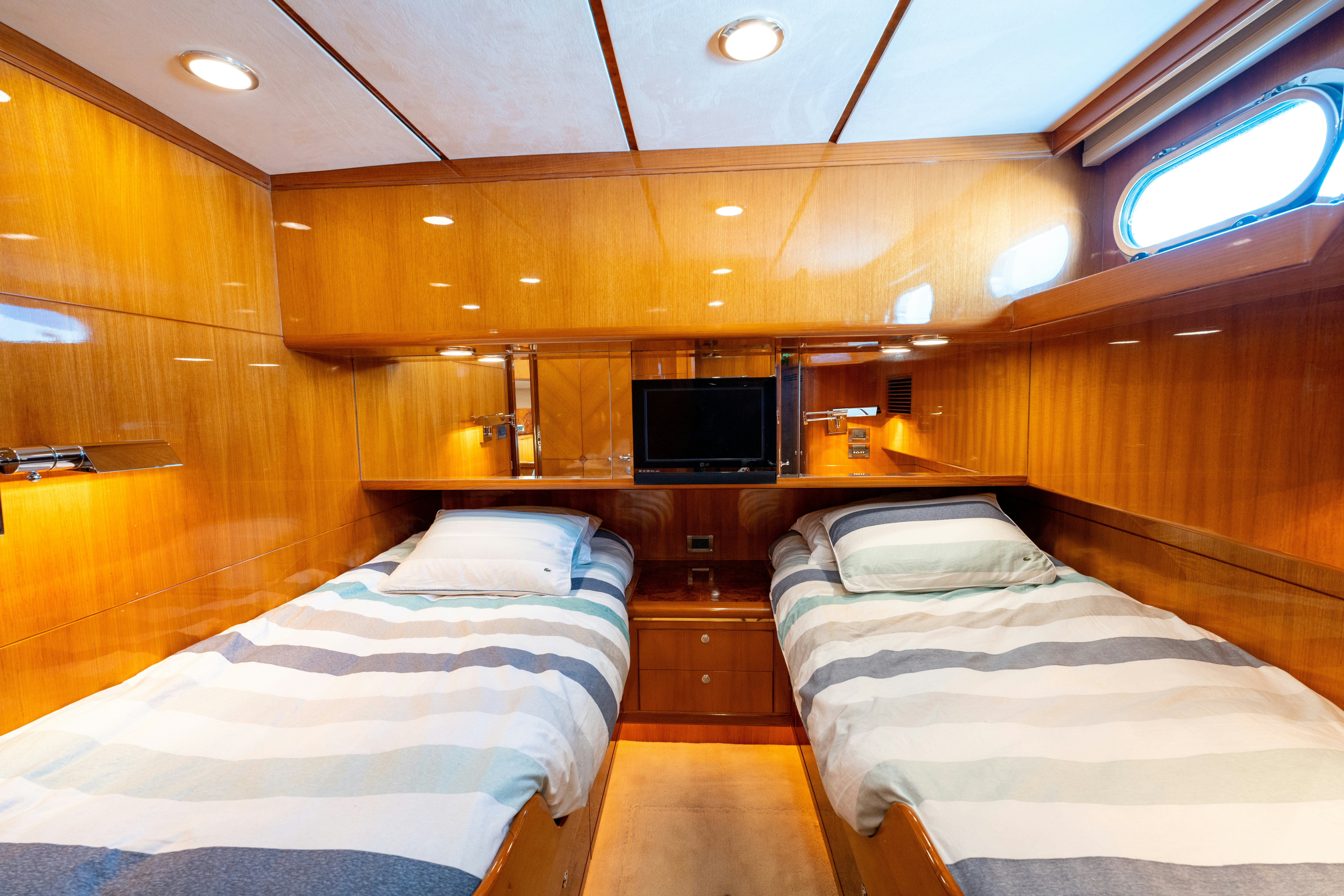 a room with a bed and a tv aboard MEMORY BANK Yacht for Sale