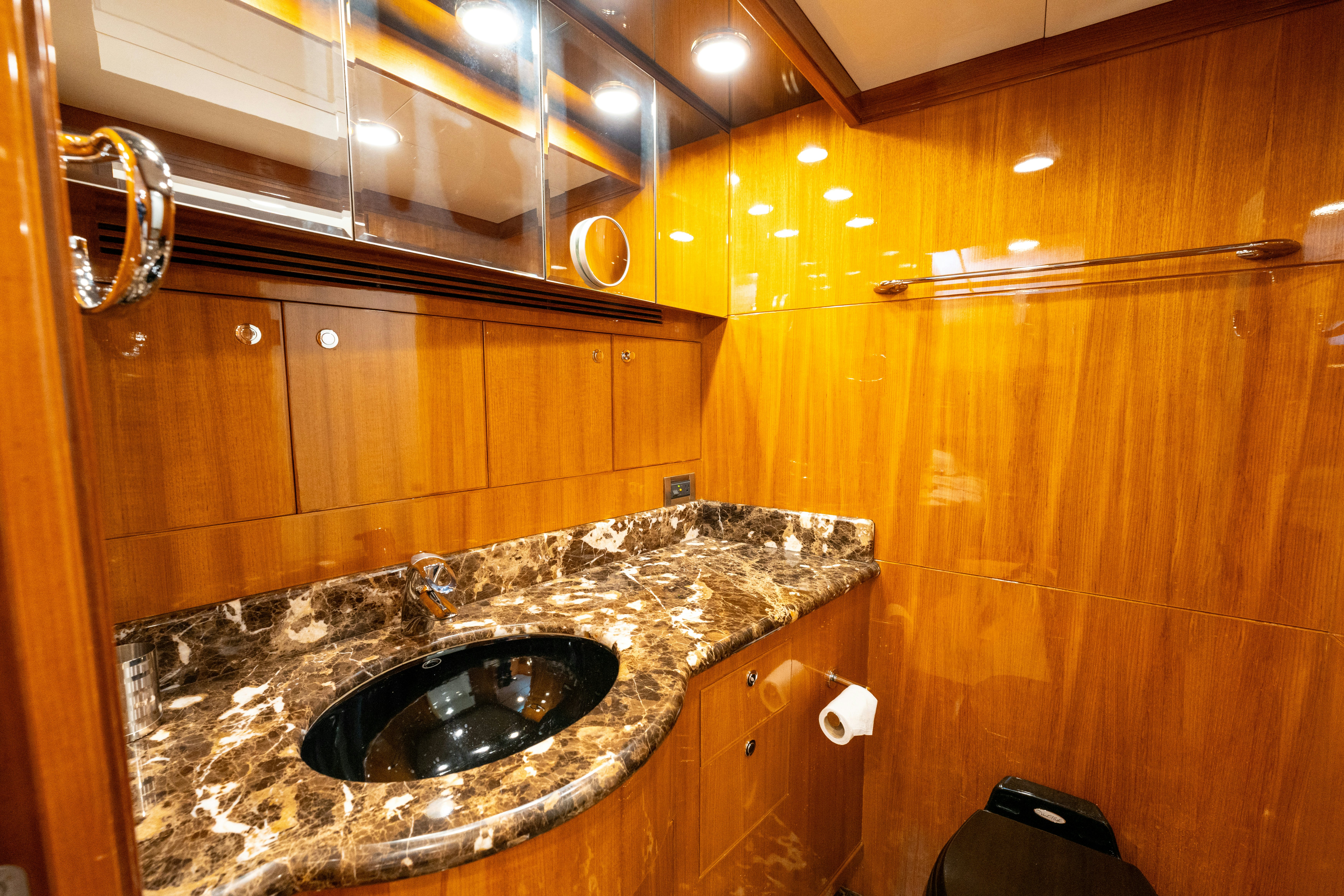 a bathroom with a sink and a mirror aboard MEMORY BANK Yacht for Sale