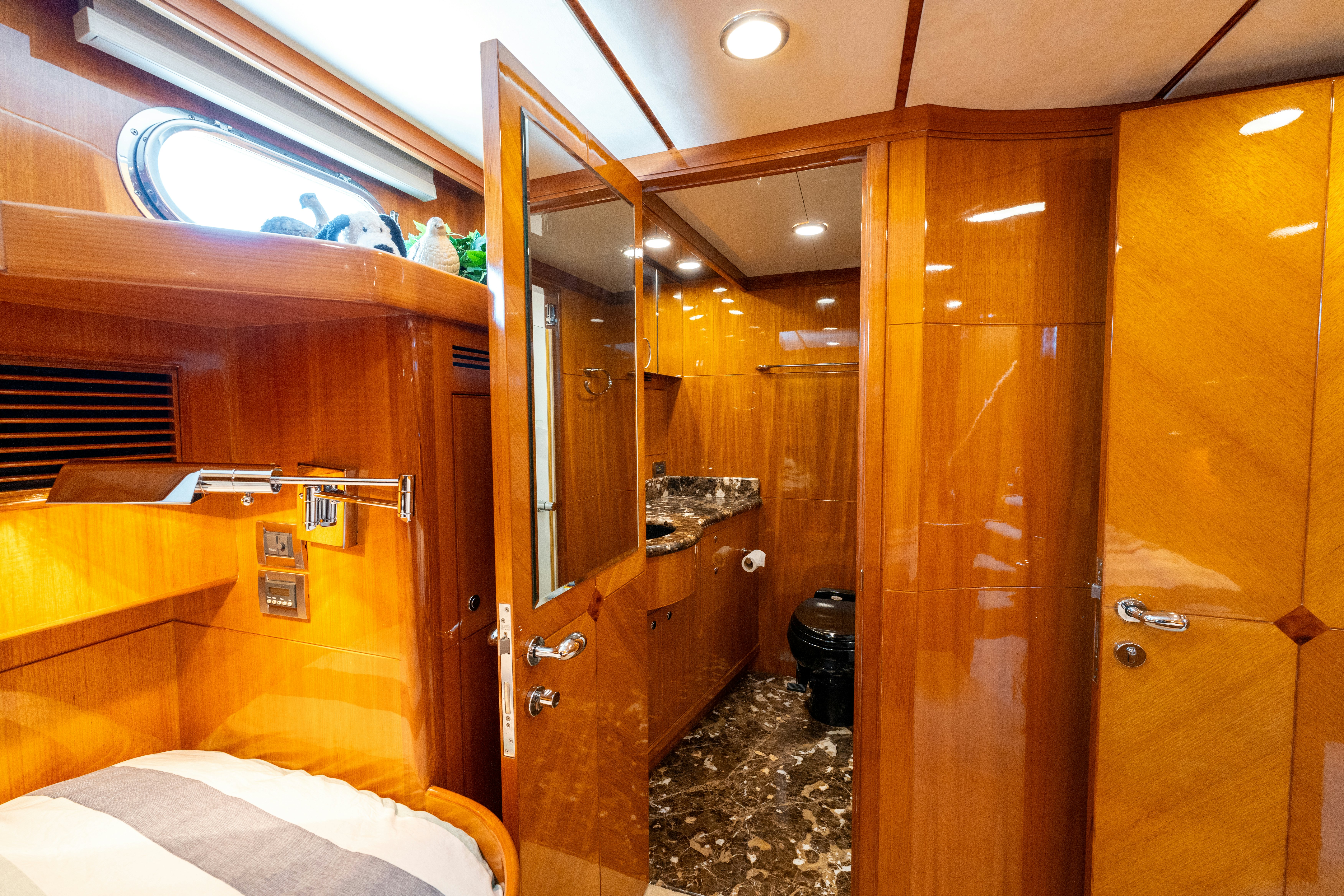a bathroom with wooden cabinets aboard MEMORY BANK Yacht for Sale