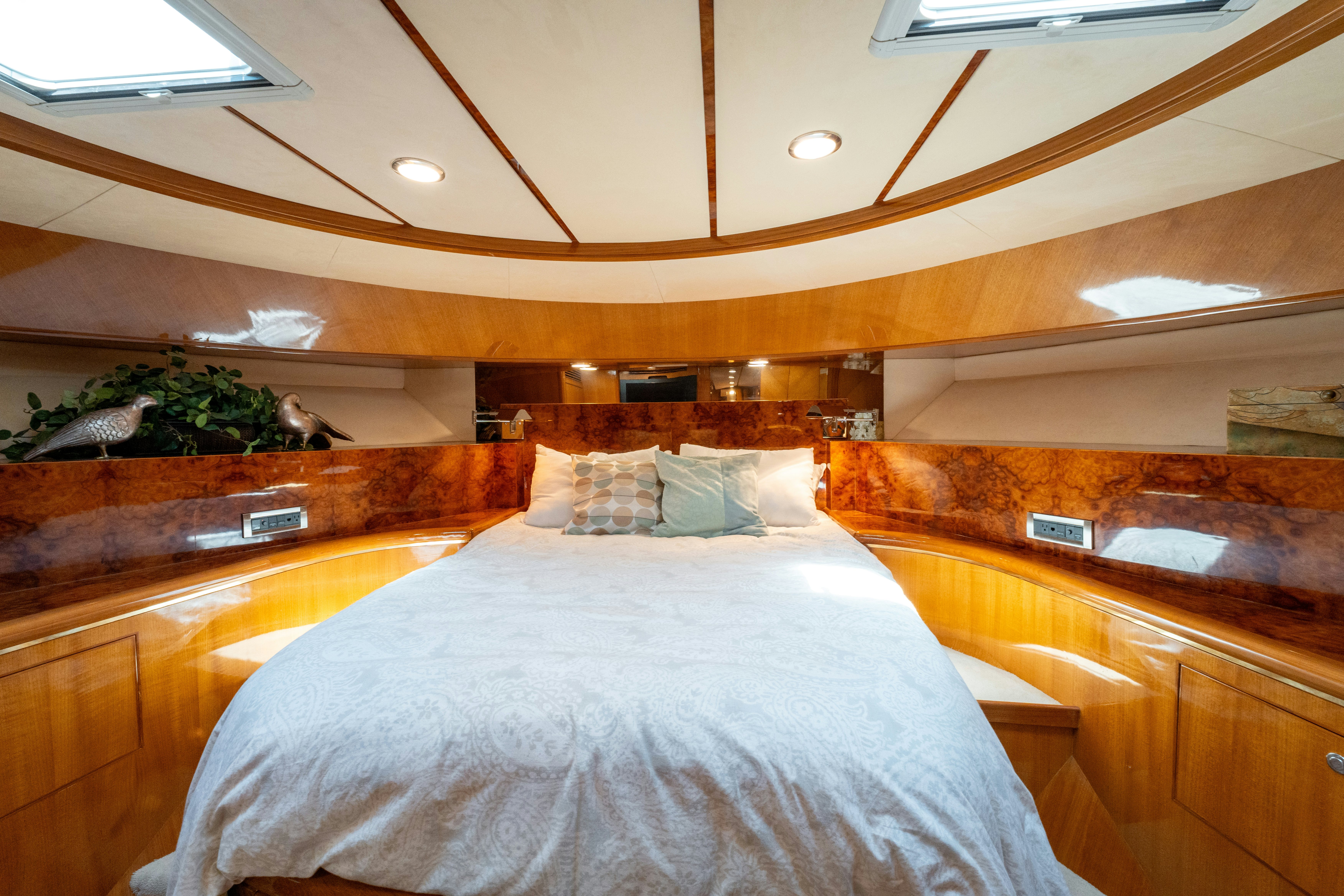 a room with a bed and a wood wall aboard MEMORY BANK Yacht for Sale
