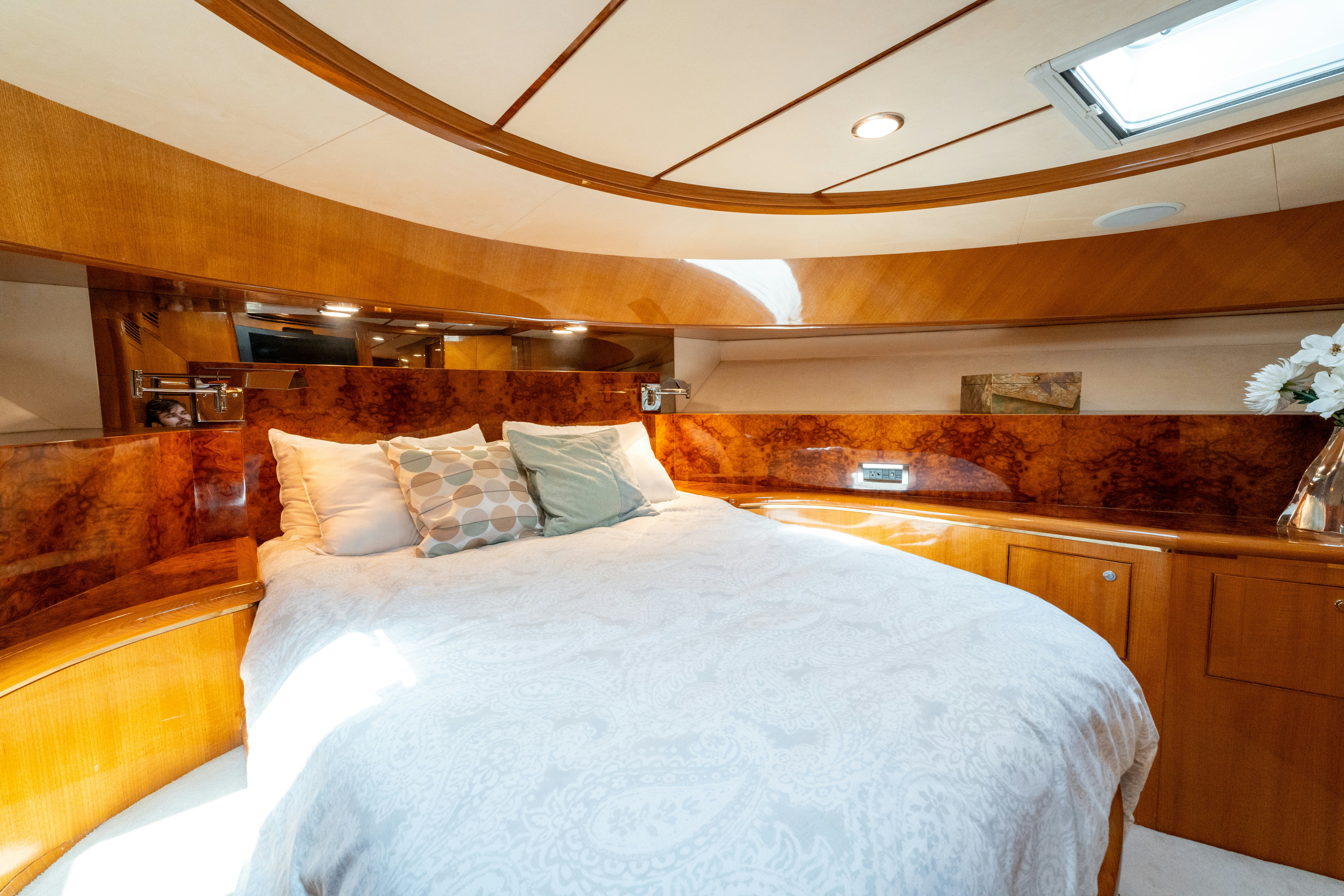 a room with a bed and a wood wall aboard MEMORY BANK Yacht for Sale