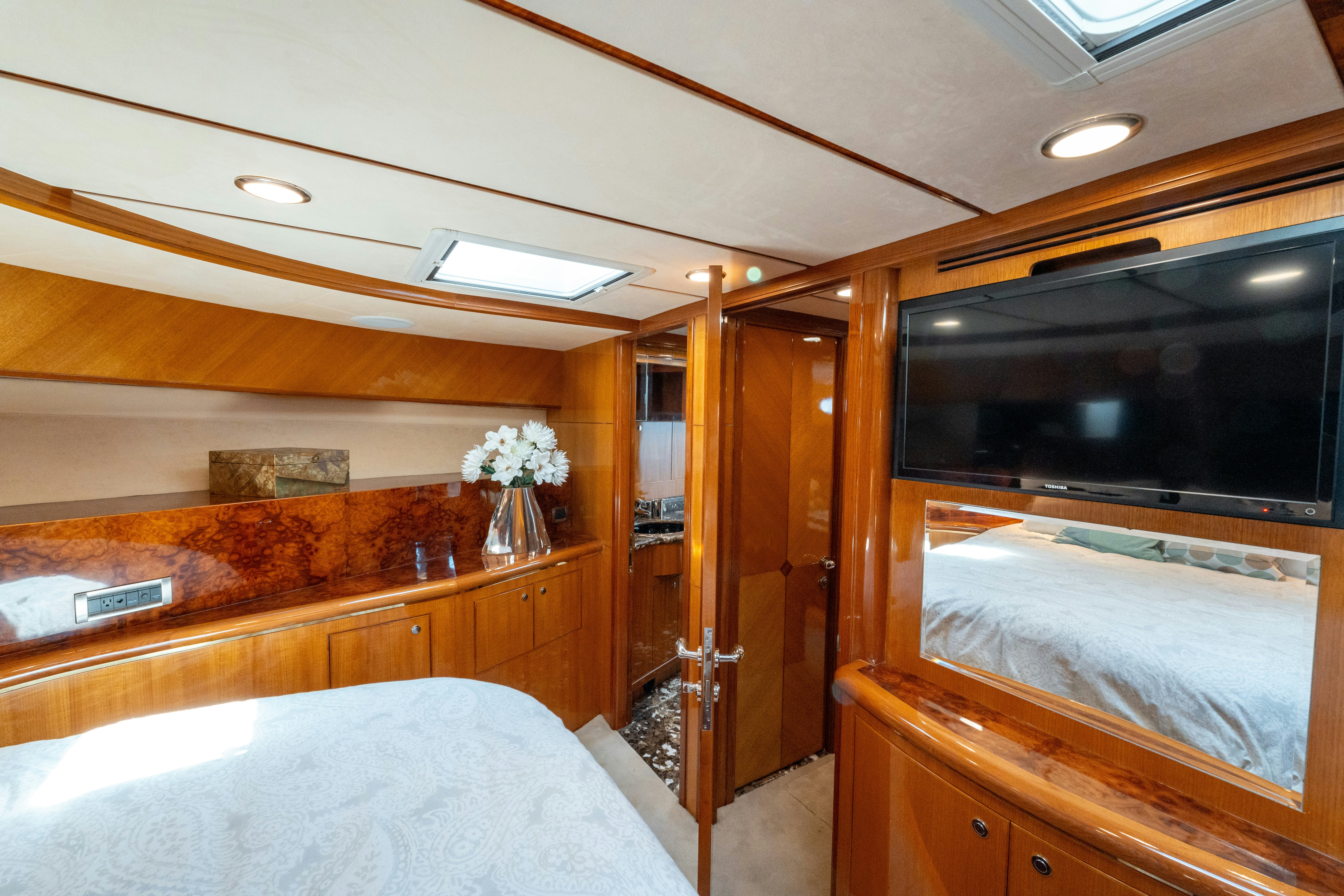 a room with a bed and a television aboard MEMORY BANK Yacht for Sale