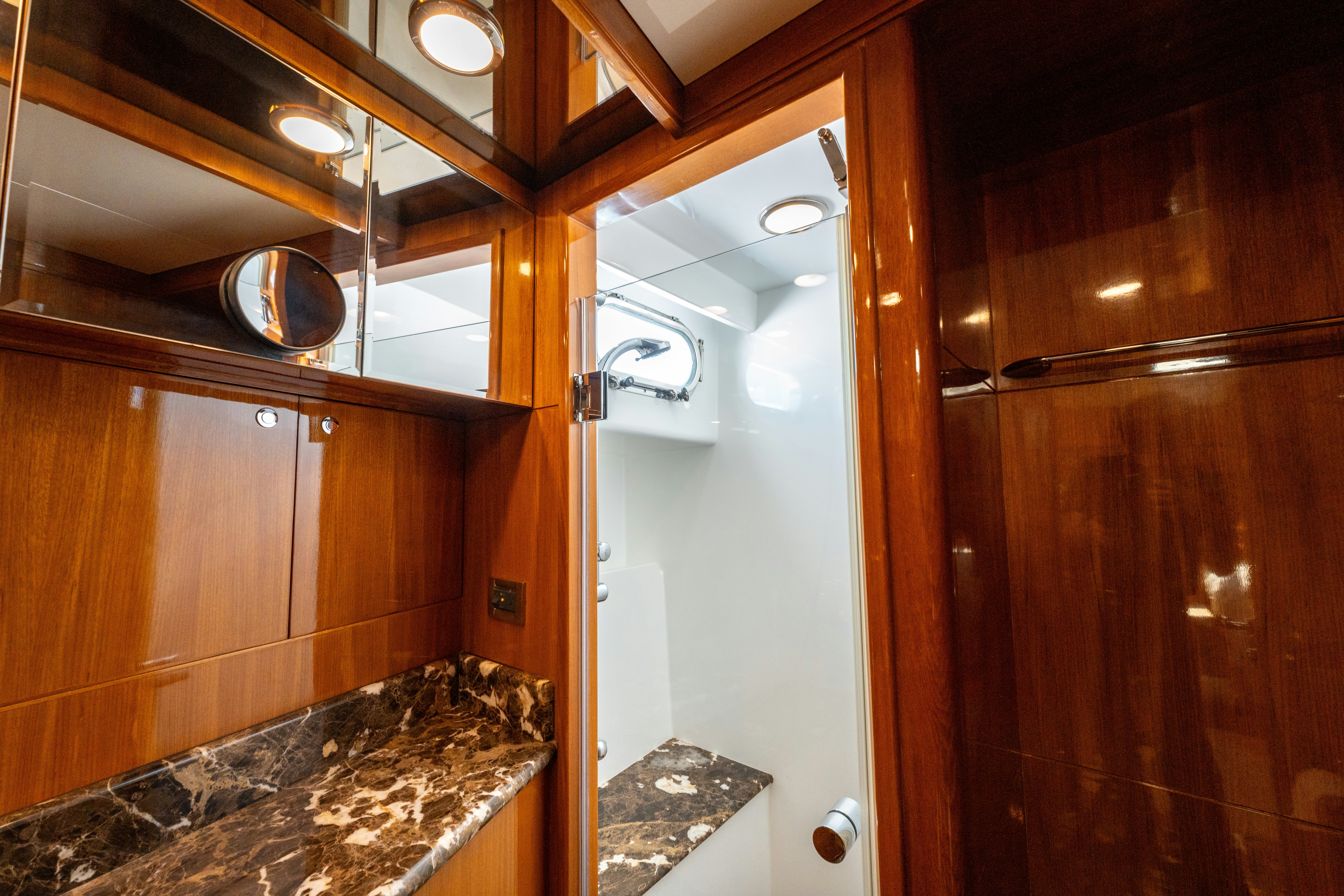 a bathroom with wooden cabinets aboard MEMORY BANK Yacht for Sale