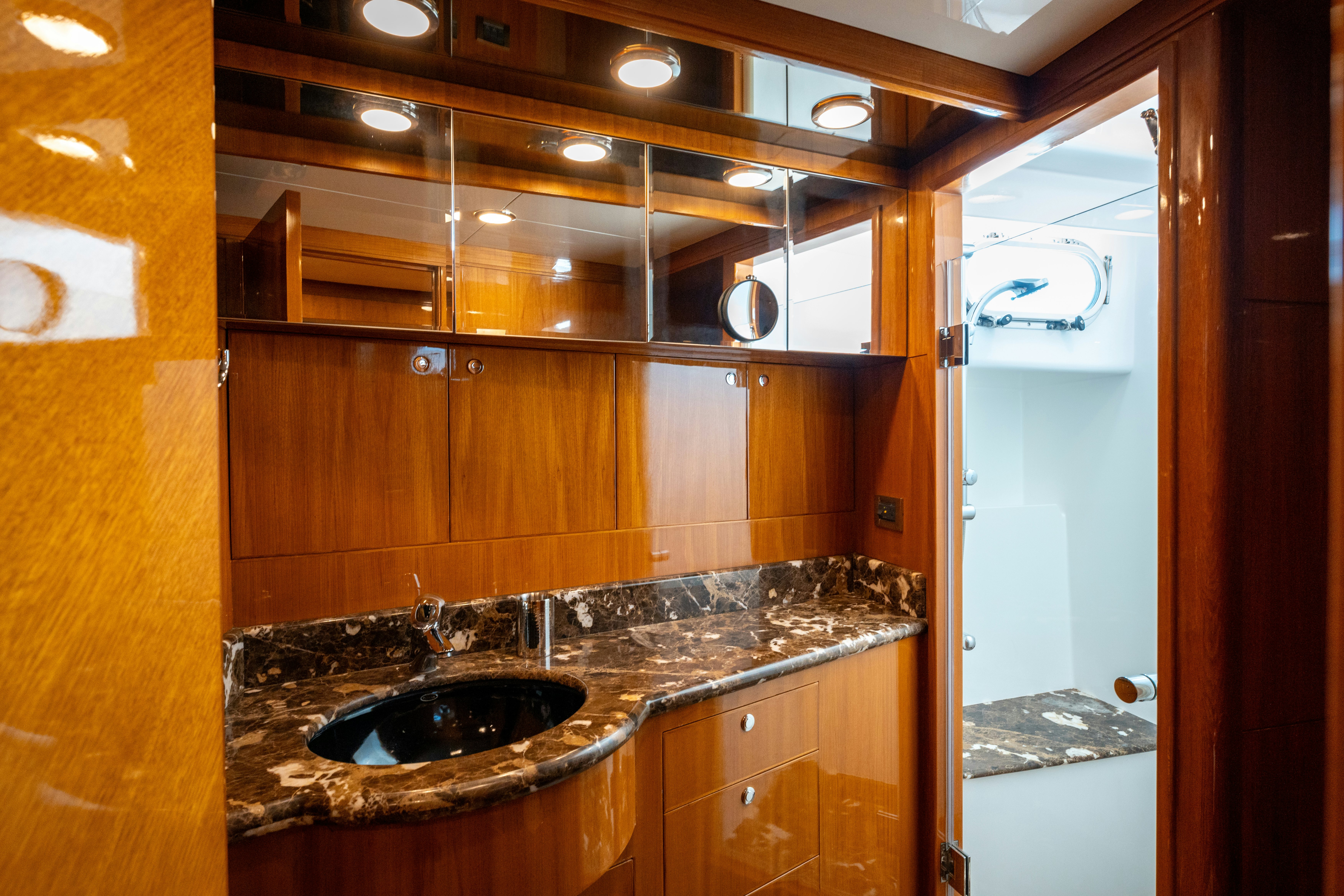 a bathroom with a sink and a mirror aboard MEMORY BANK Yacht for Sale