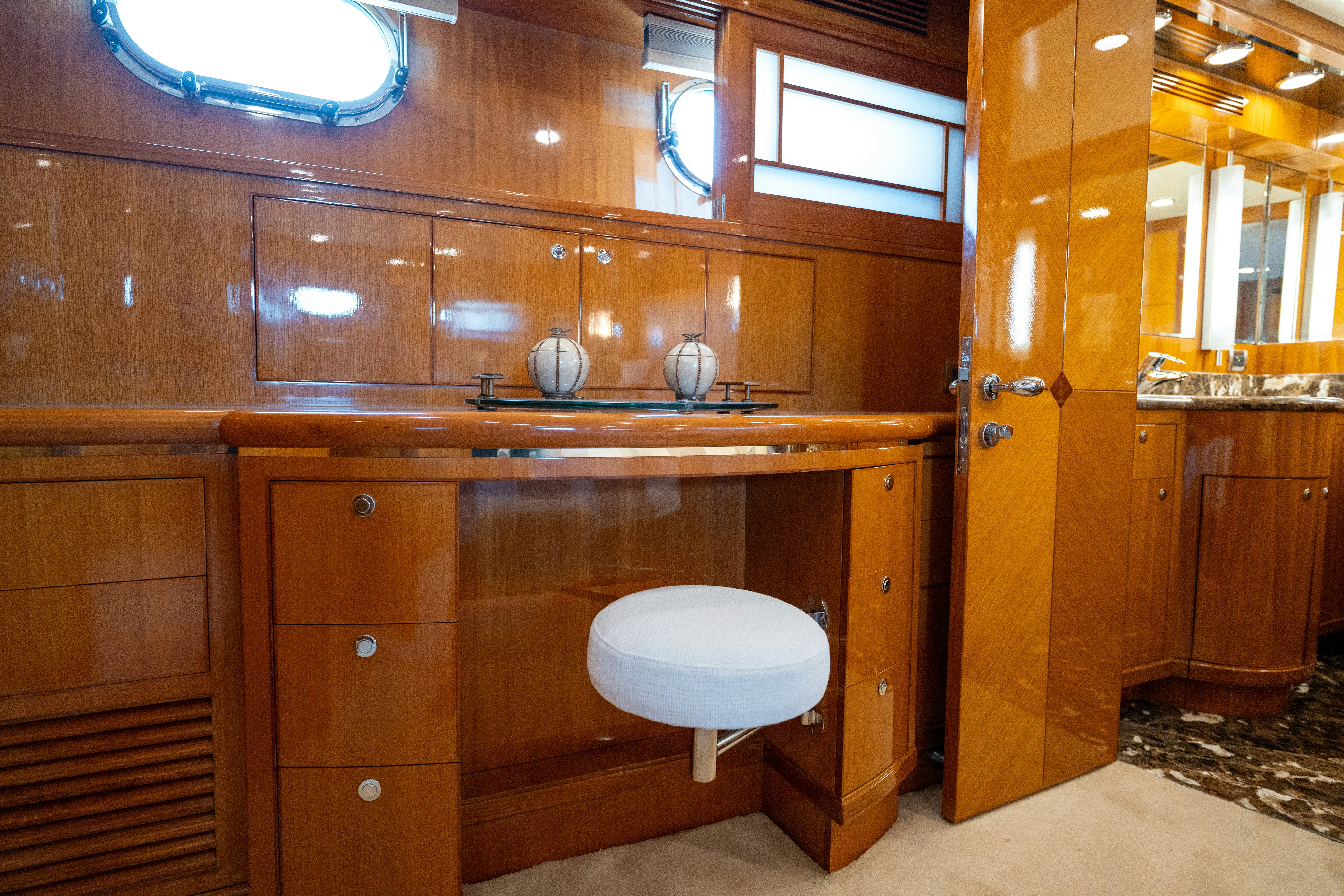 a bathroom with wooden cabinets aboard MEMORY BANK Yacht for Sale