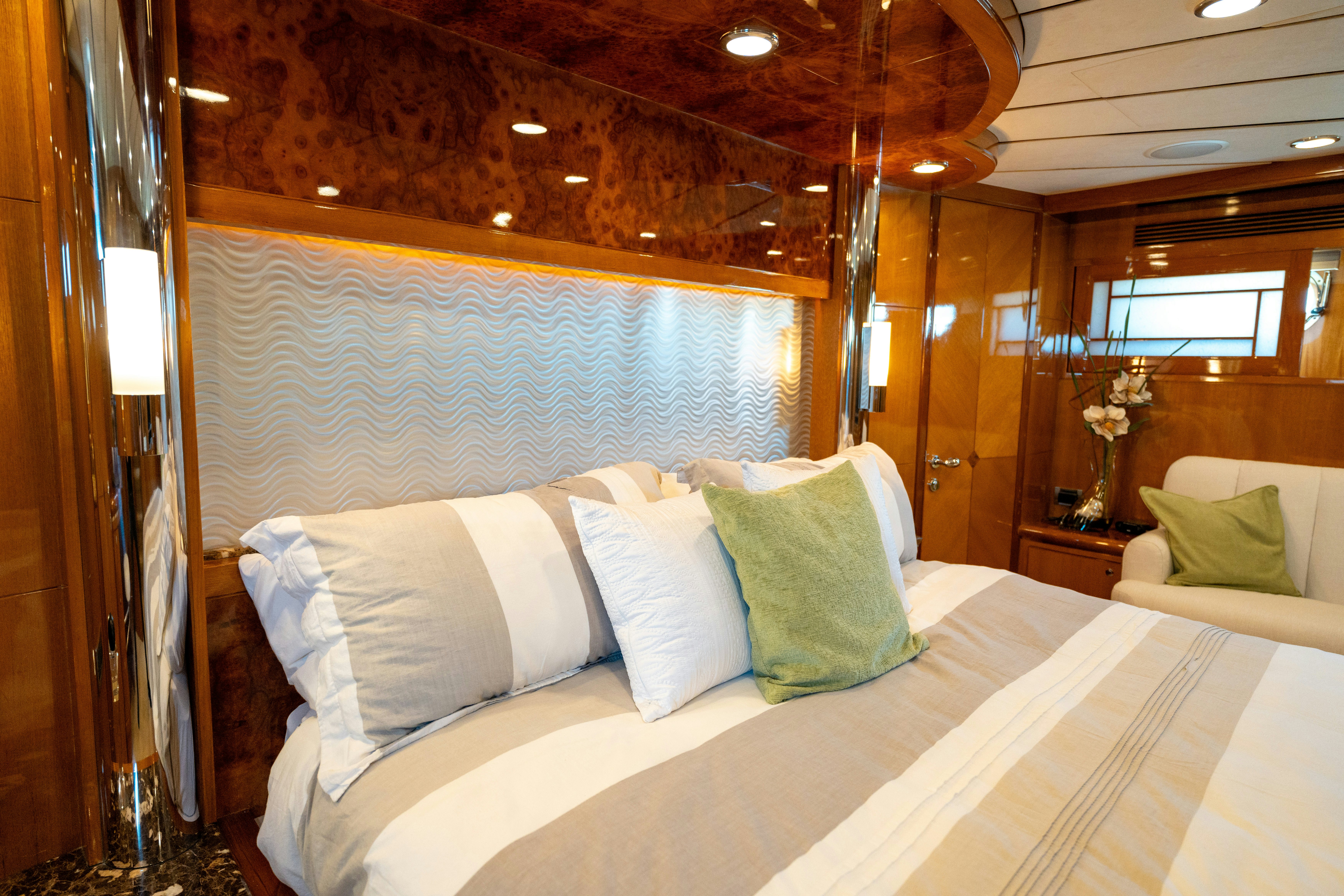 a room with a bed and a mirror aboard MEMORY BANK Yacht for Sale