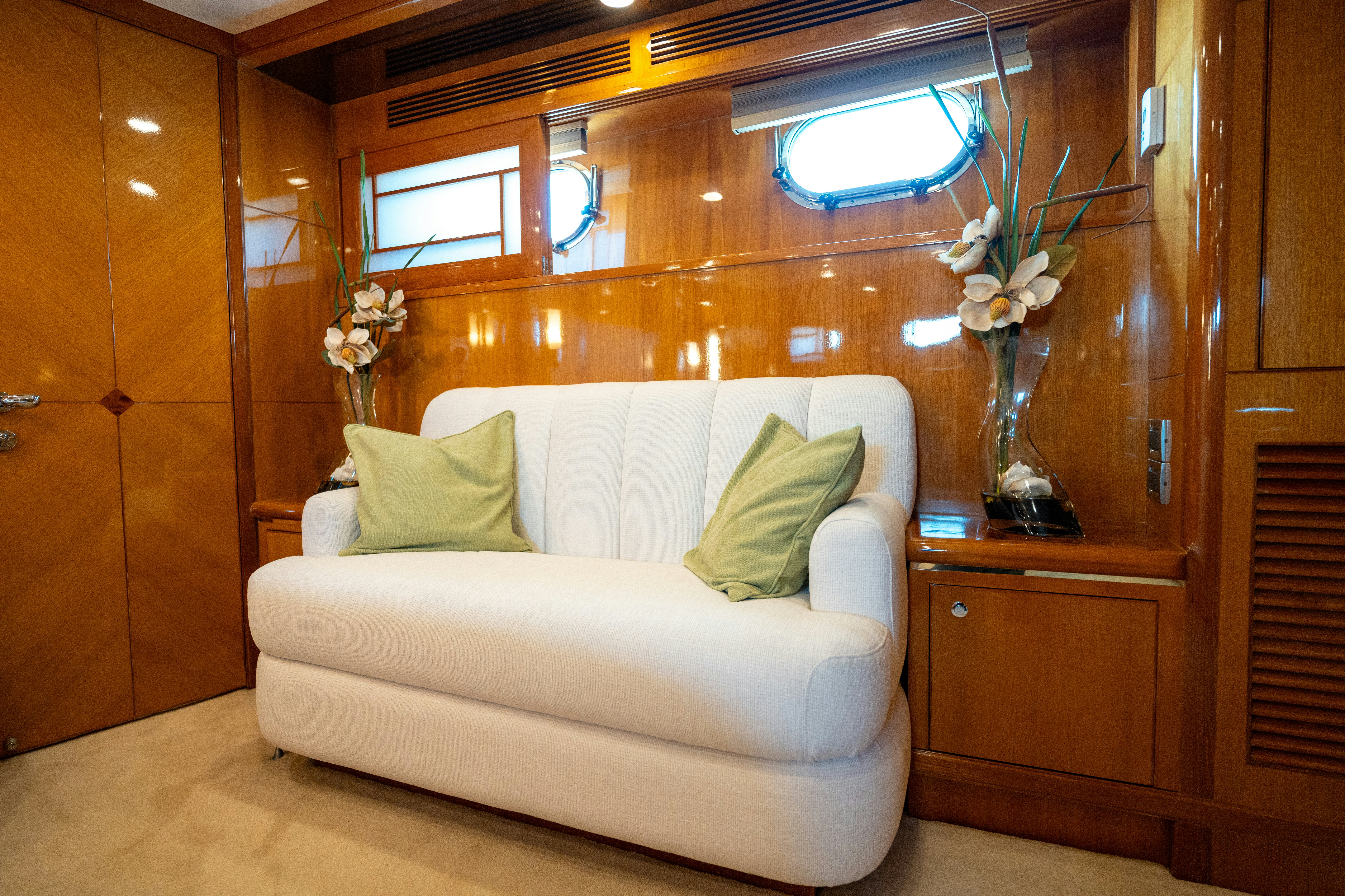 a white couch in a room aboard MEMORY BANK Yacht for Sale