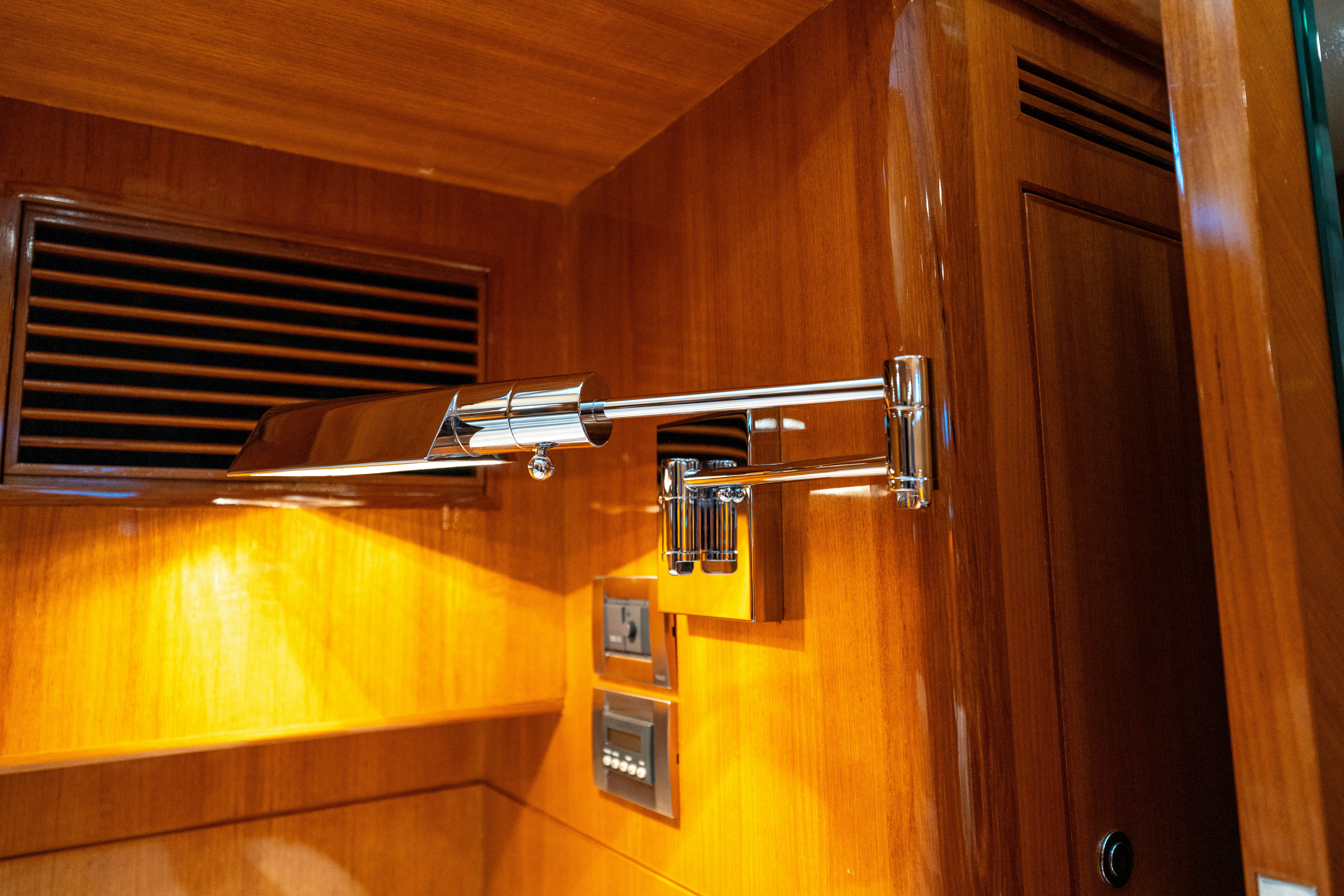 a wooden cabinet with a glass door aboard MEMORY BANK Yacht for Sale