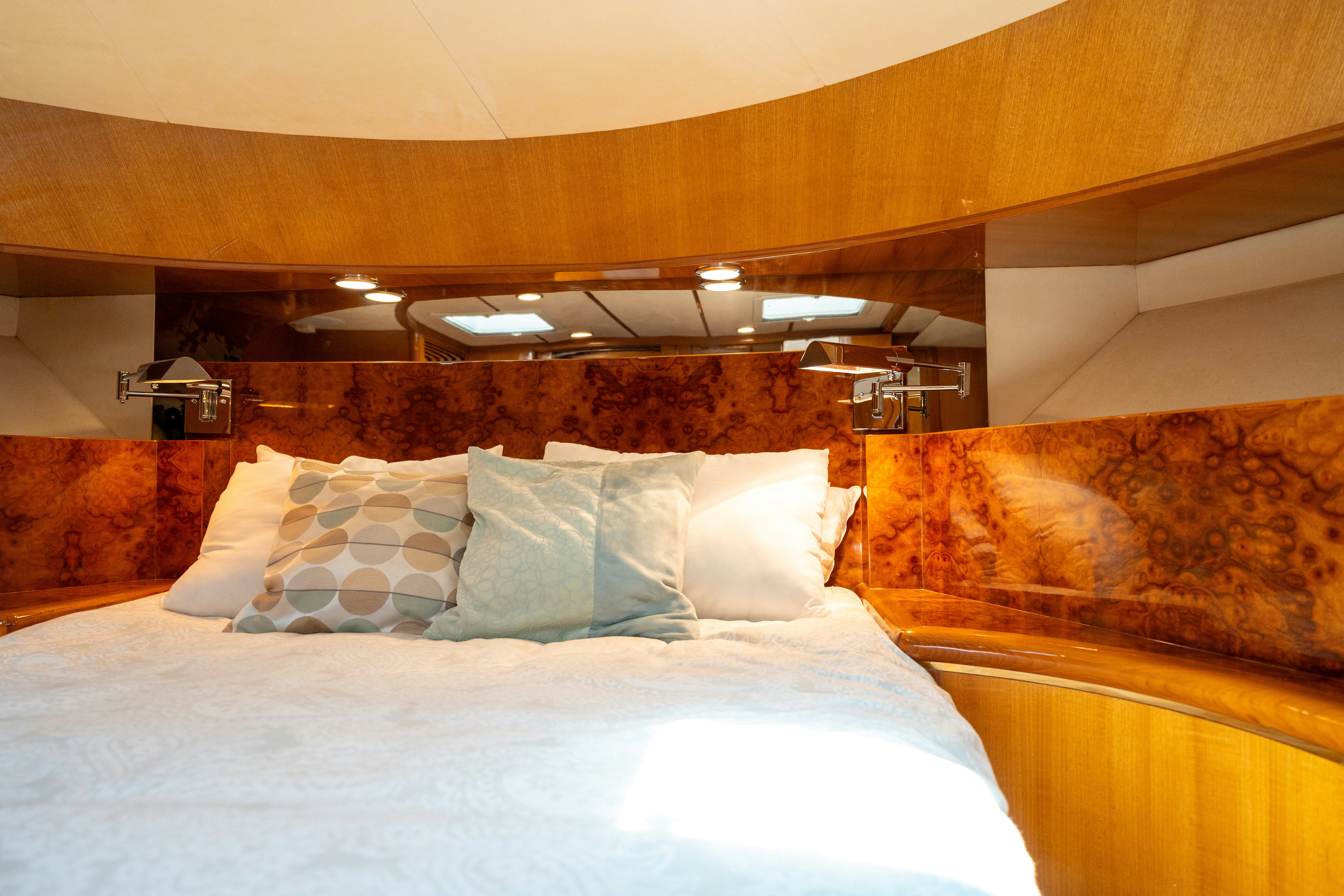 a bed with white sheets aboard MEMORY BANK Yacht for Sale