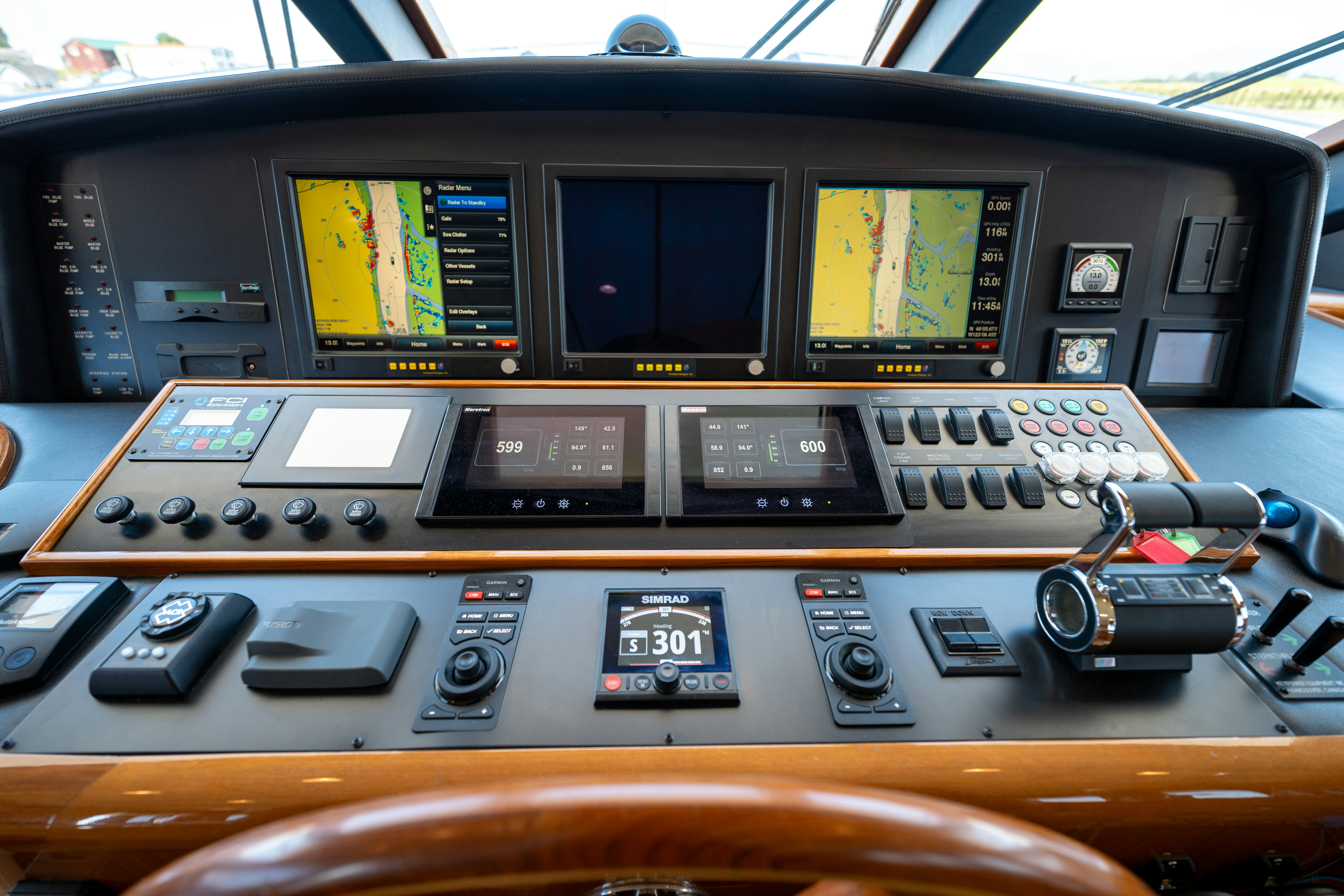 a wooden airplane with a screen and buttons aboard MEMORY BANK Yacht for Sale