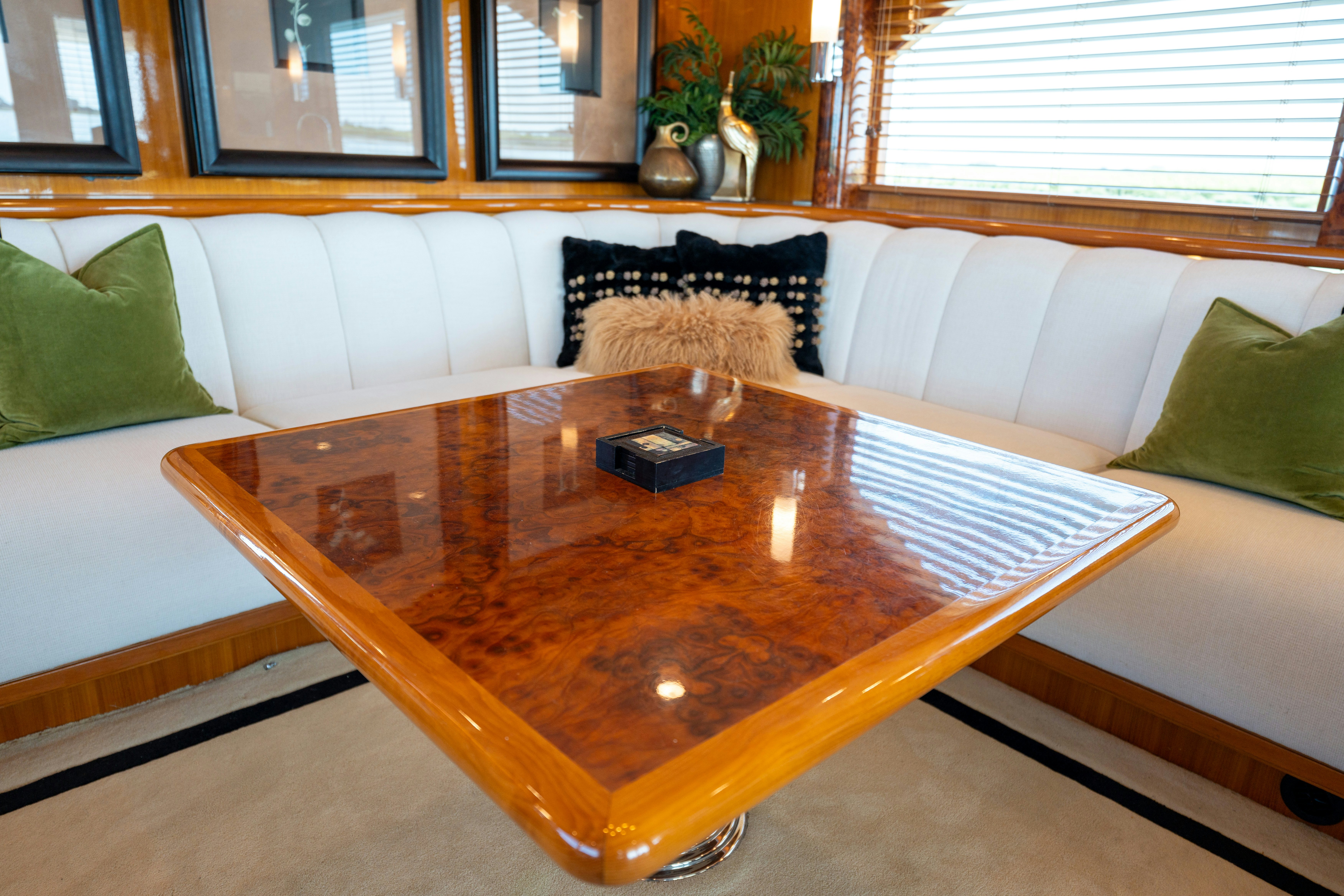 a table with a candle on it aboard MEMORY BANK Yacht for Sale