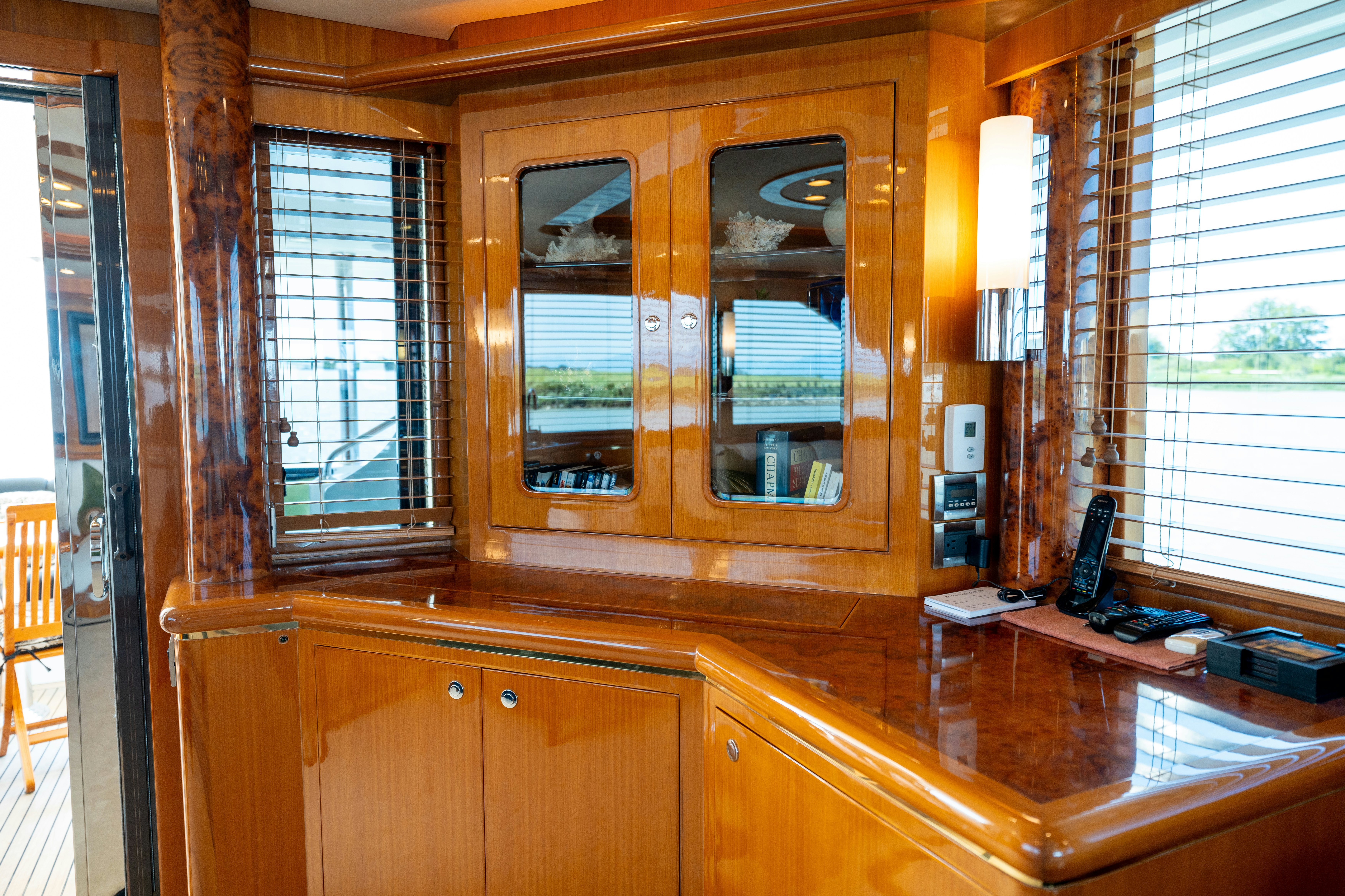 a wooden cabinet with a desk and a computer on it aboard MEMORY BANK Yacht for Sale