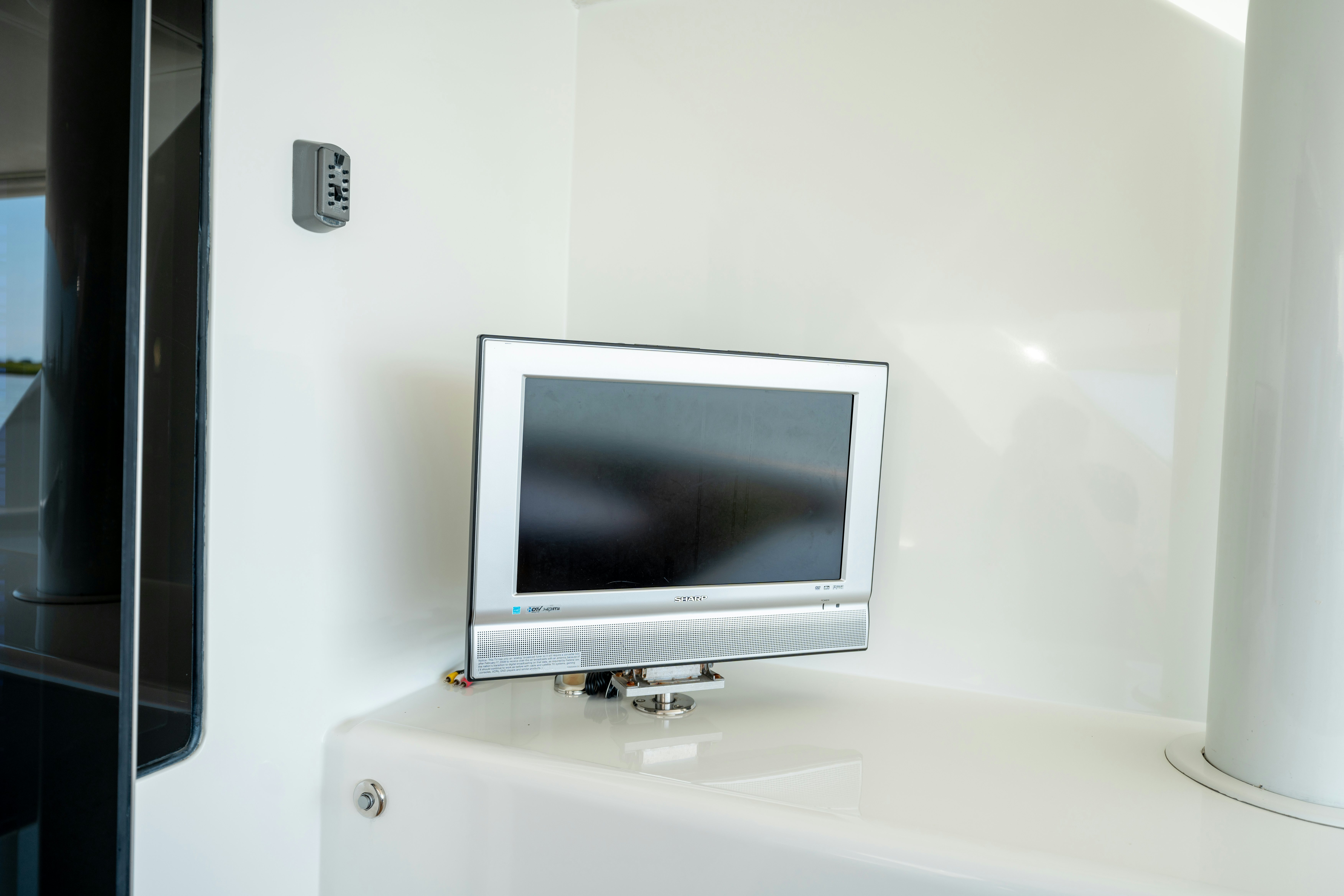 a television on a white wall aboard MEMORY BANK Yacht for Sale