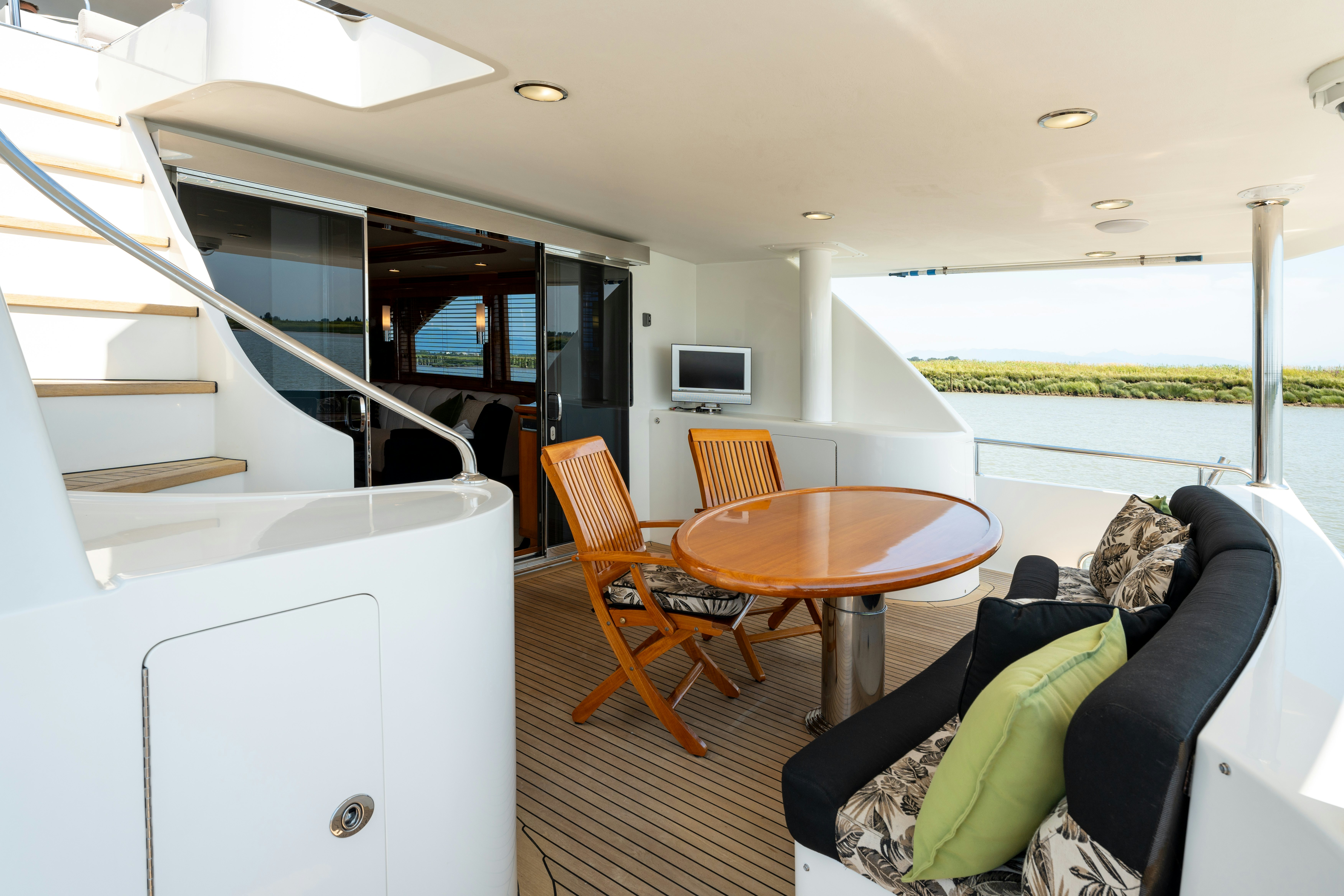 a living room with a couch and a table aboard MEMORY BANK Yacht for Sale