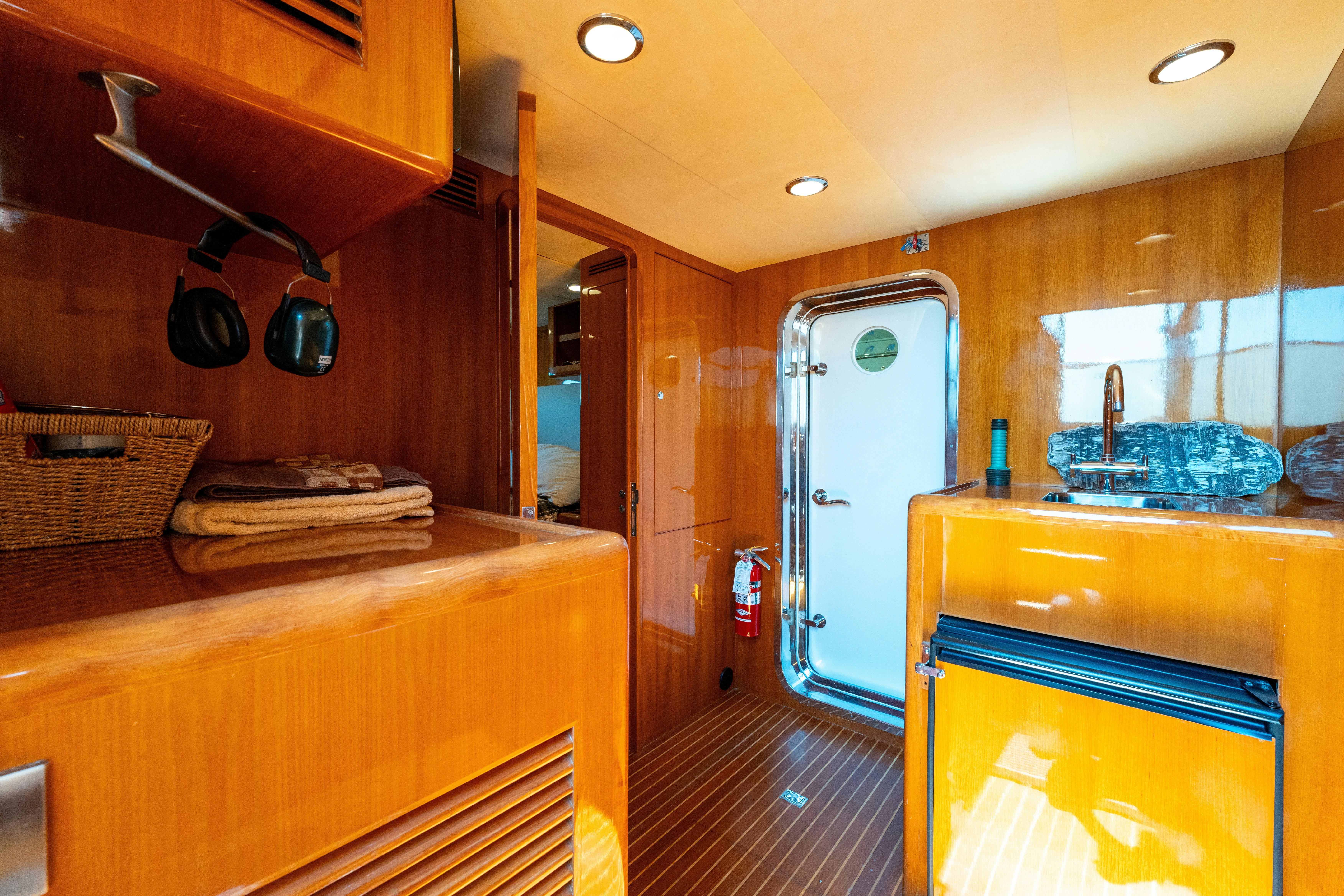 a kitchen with wooden cabinets aboard MEMORY BANK Yacht for Sale