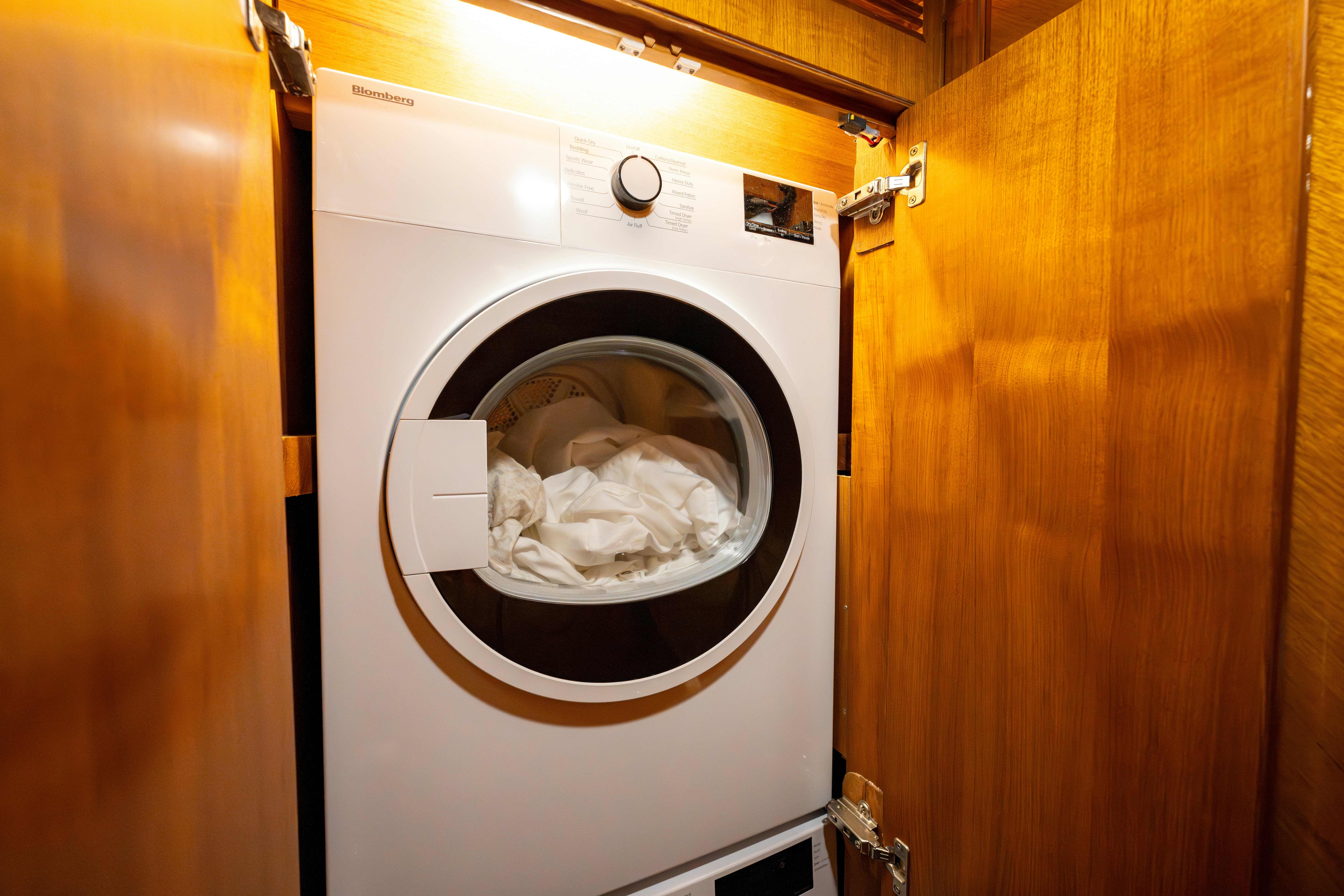 a washing machine with a white towel on it aboard MEMORY BANK Yacht for Sale