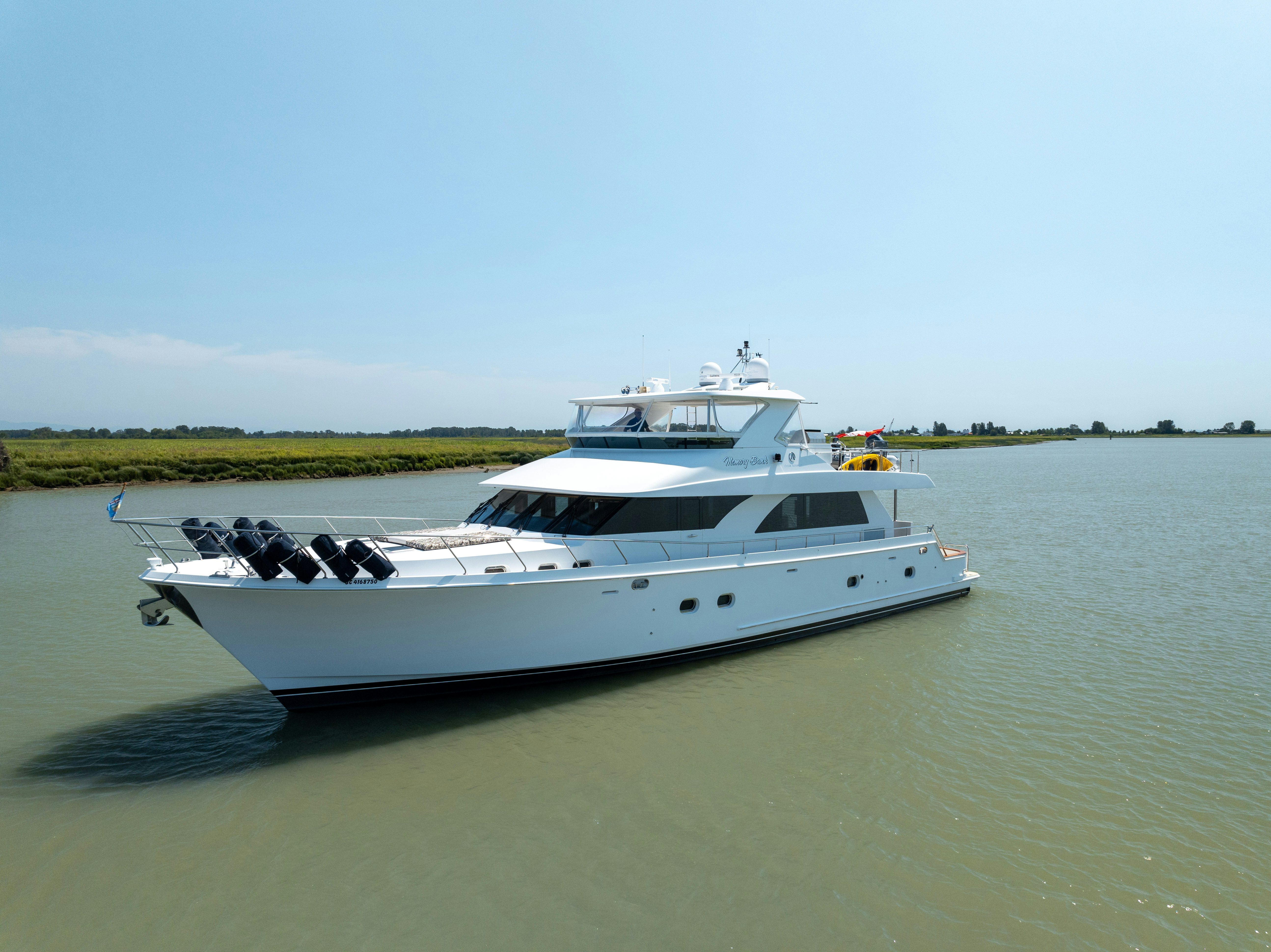 a white boat in the water aboard MEMORY BANK Yacht for Sale