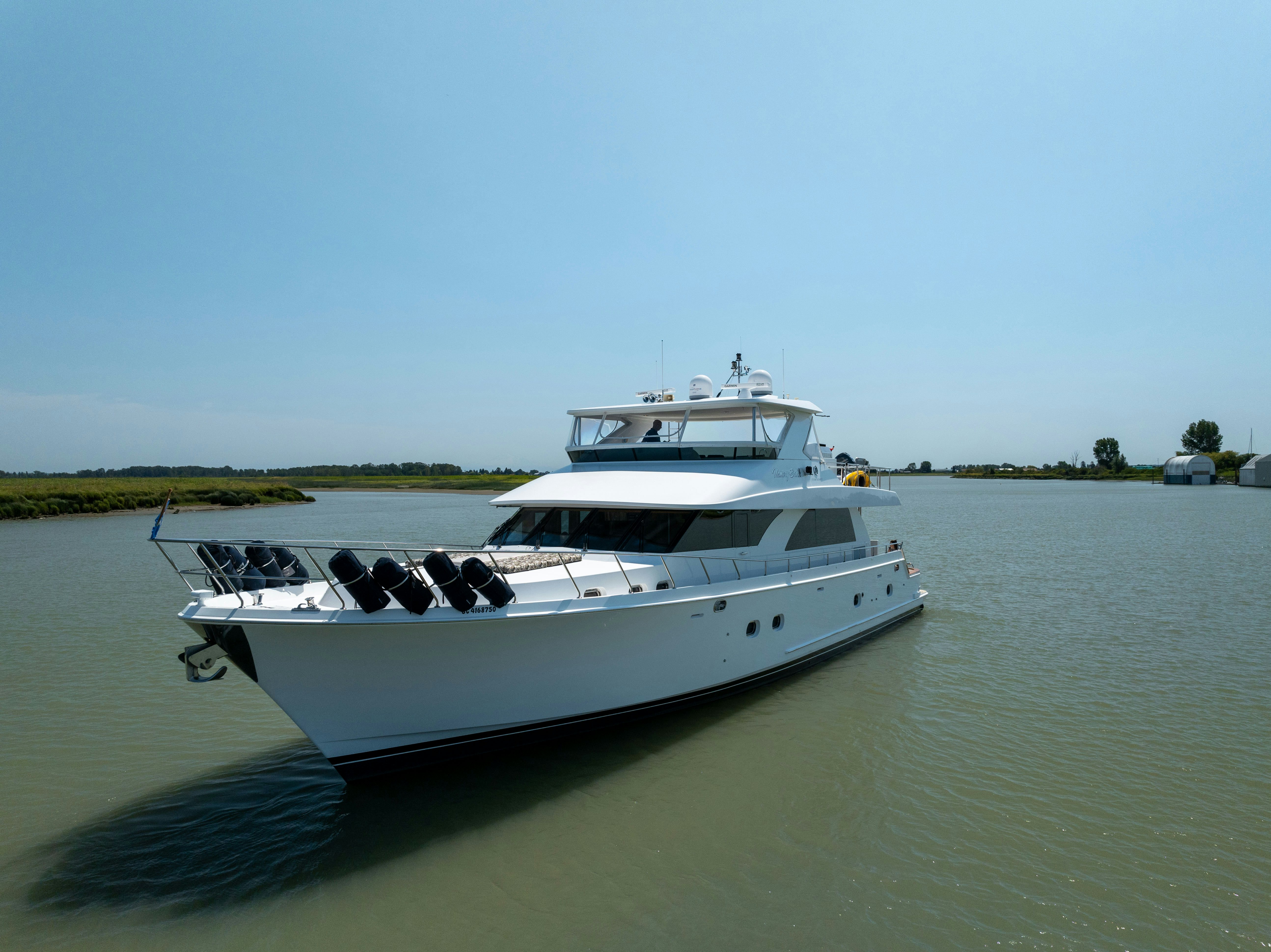 a white boat on water aboard MEMORY BANK Yacht for Sale