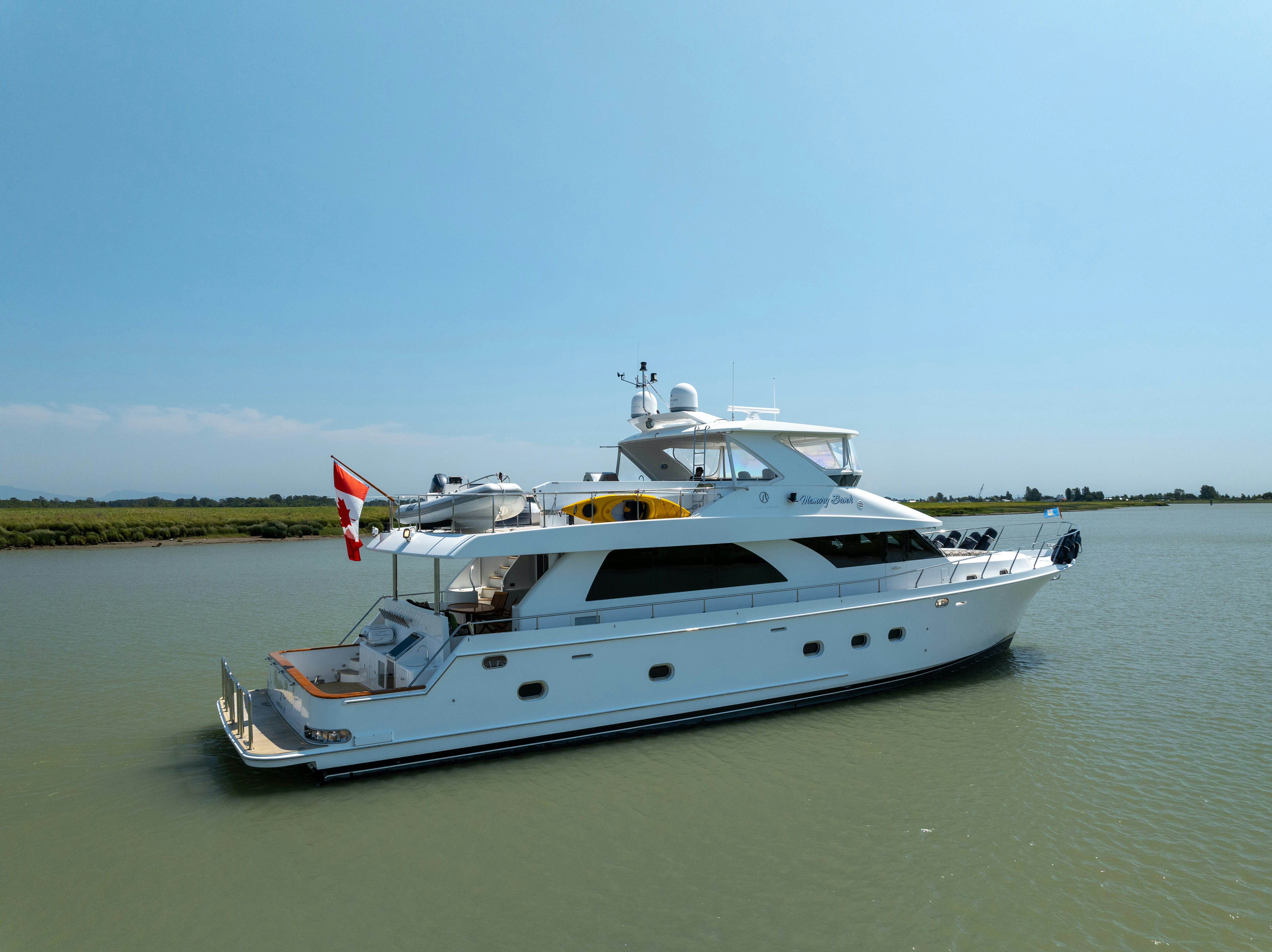 a white yacht in the water aboard MEMORY BANK Yacht for Sale