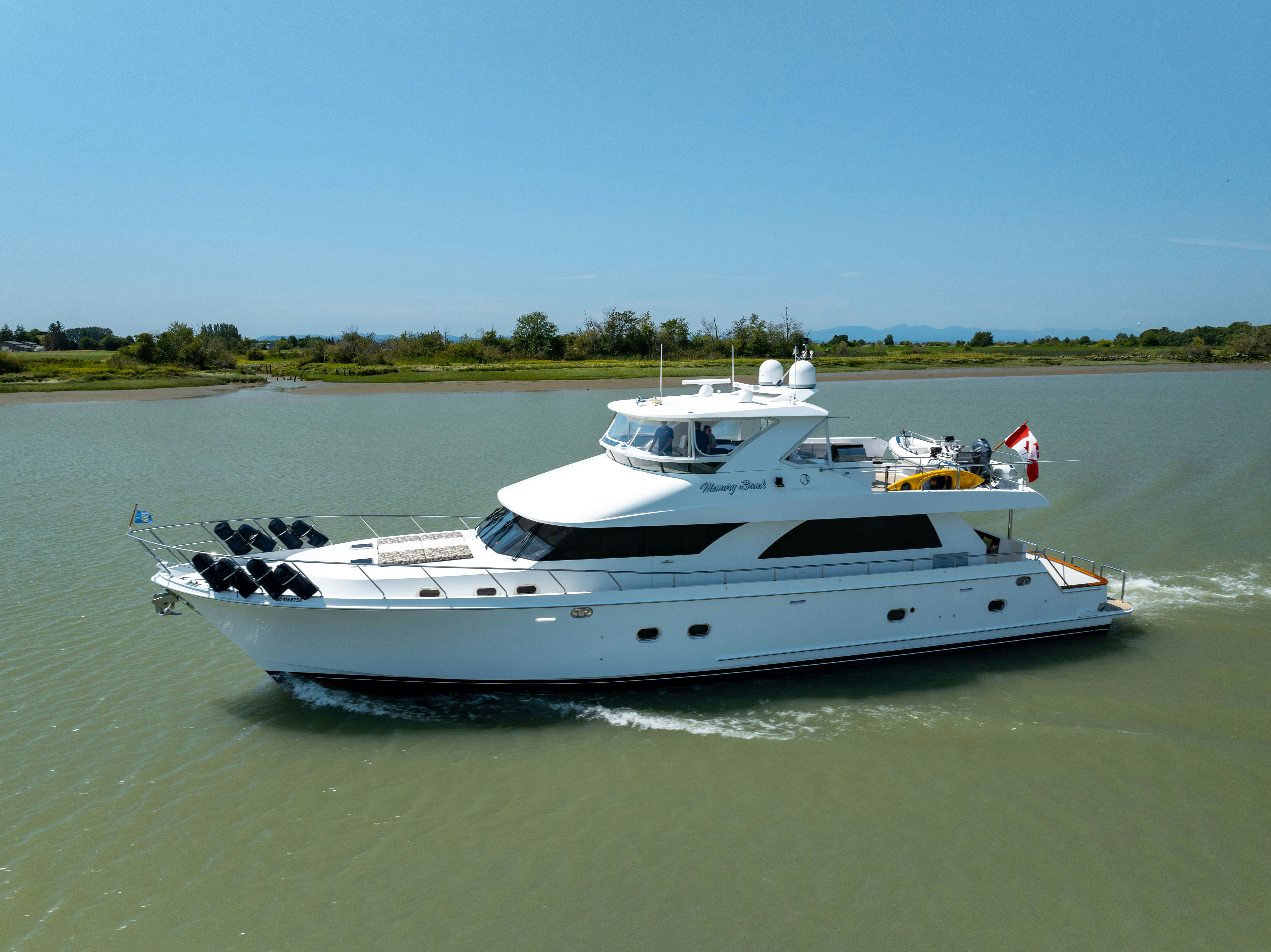 a white boat on water aboard MEMORY BANK Yacht for Sale