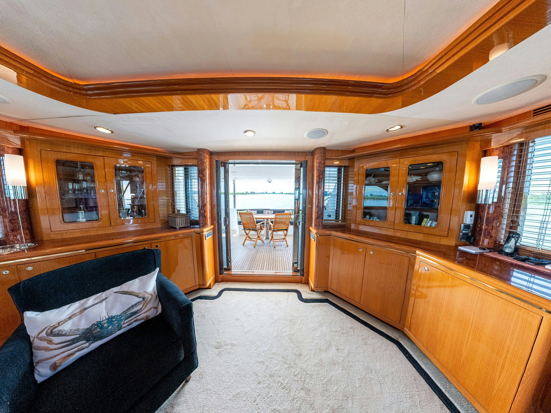 a large bedroom with wood cabinets aboard MEMORY BANK Yacht for Sale