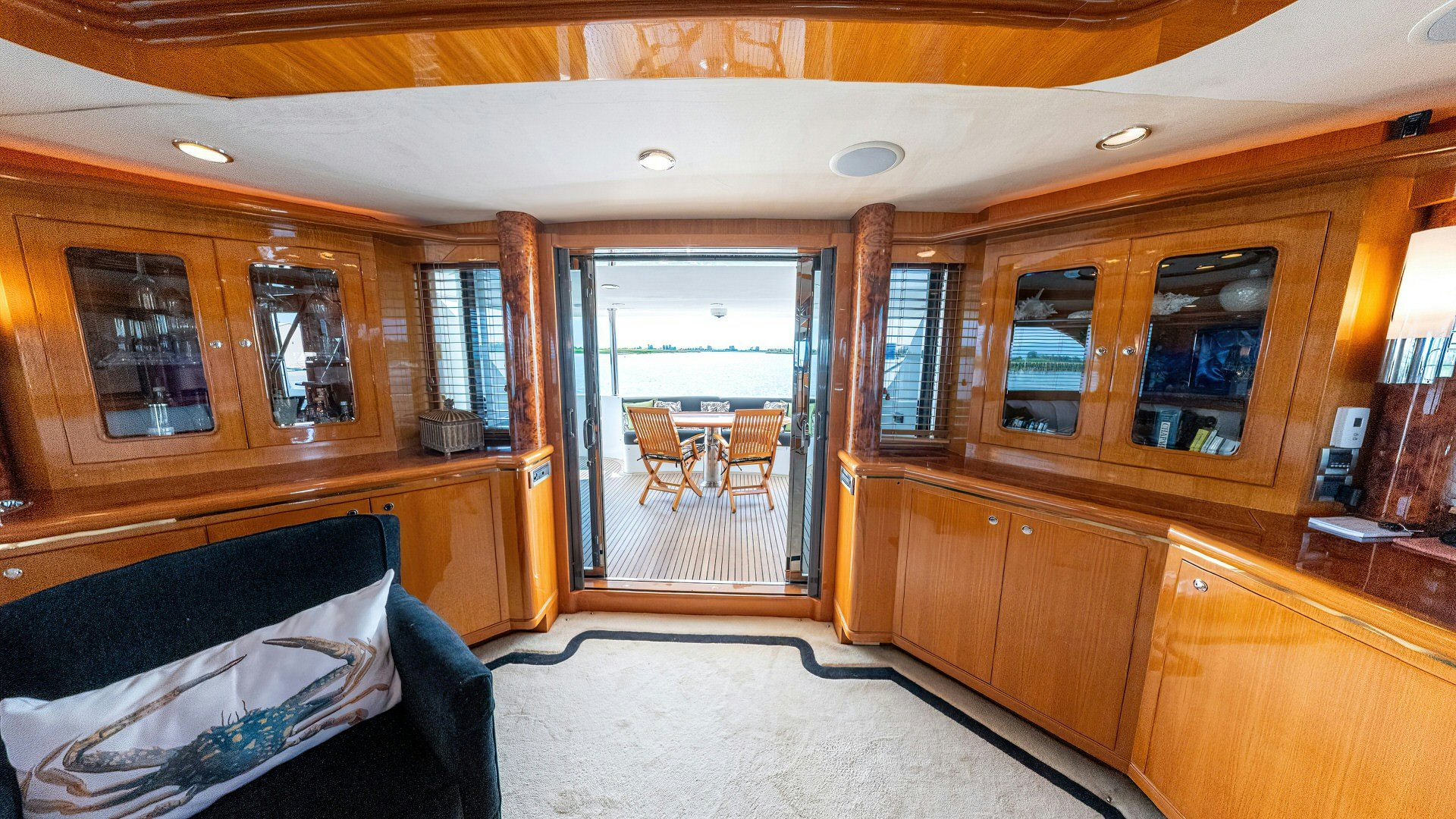 a bedroom with wood cabinets aboard MEMORY BANK Yacht for Sale