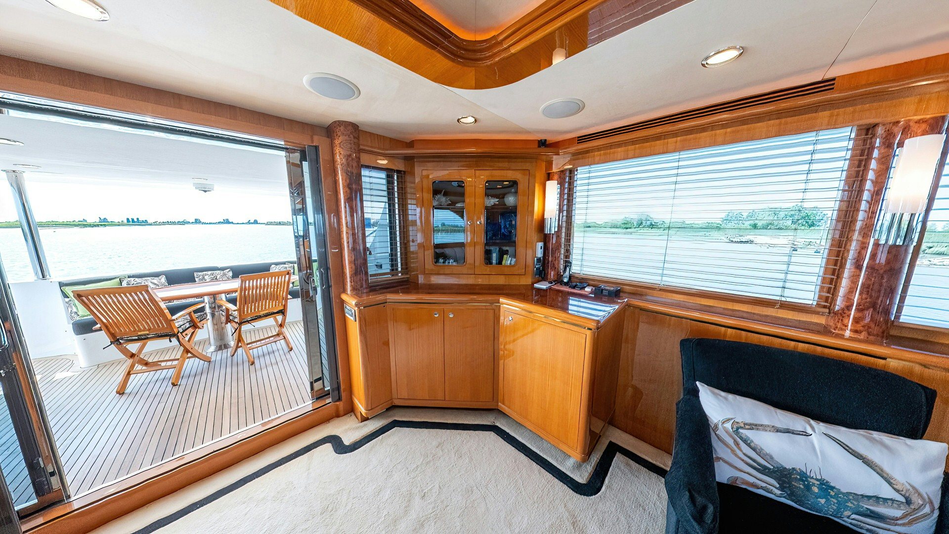 a room with a bed and a table and chairs aboard MEMORY BANK Yacht for Sale