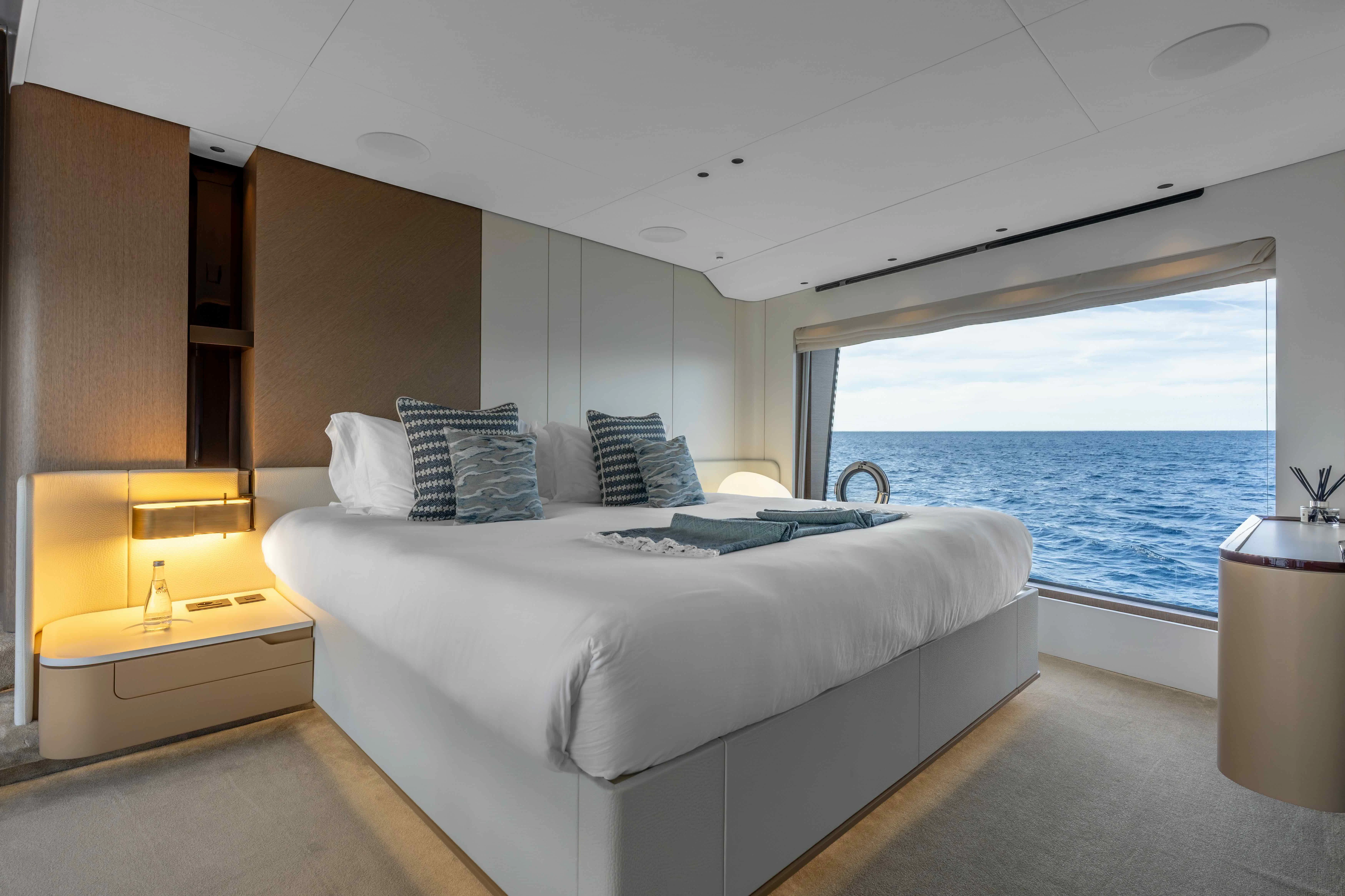 a room with a bed and a window aboard ST JUDE Yacht for Sale