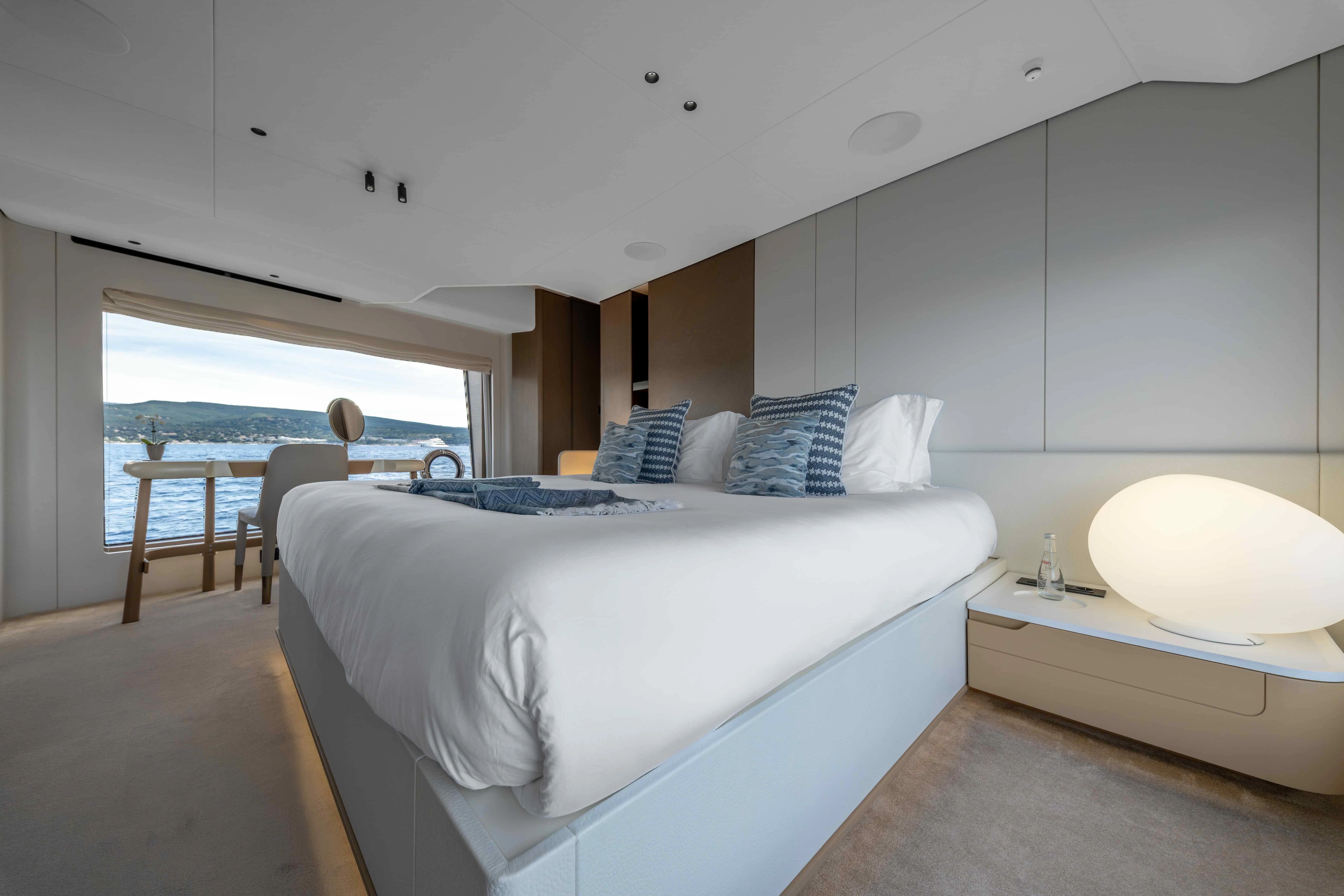 a room with a bed and a table aboard ST JUDE Yacht for Sale