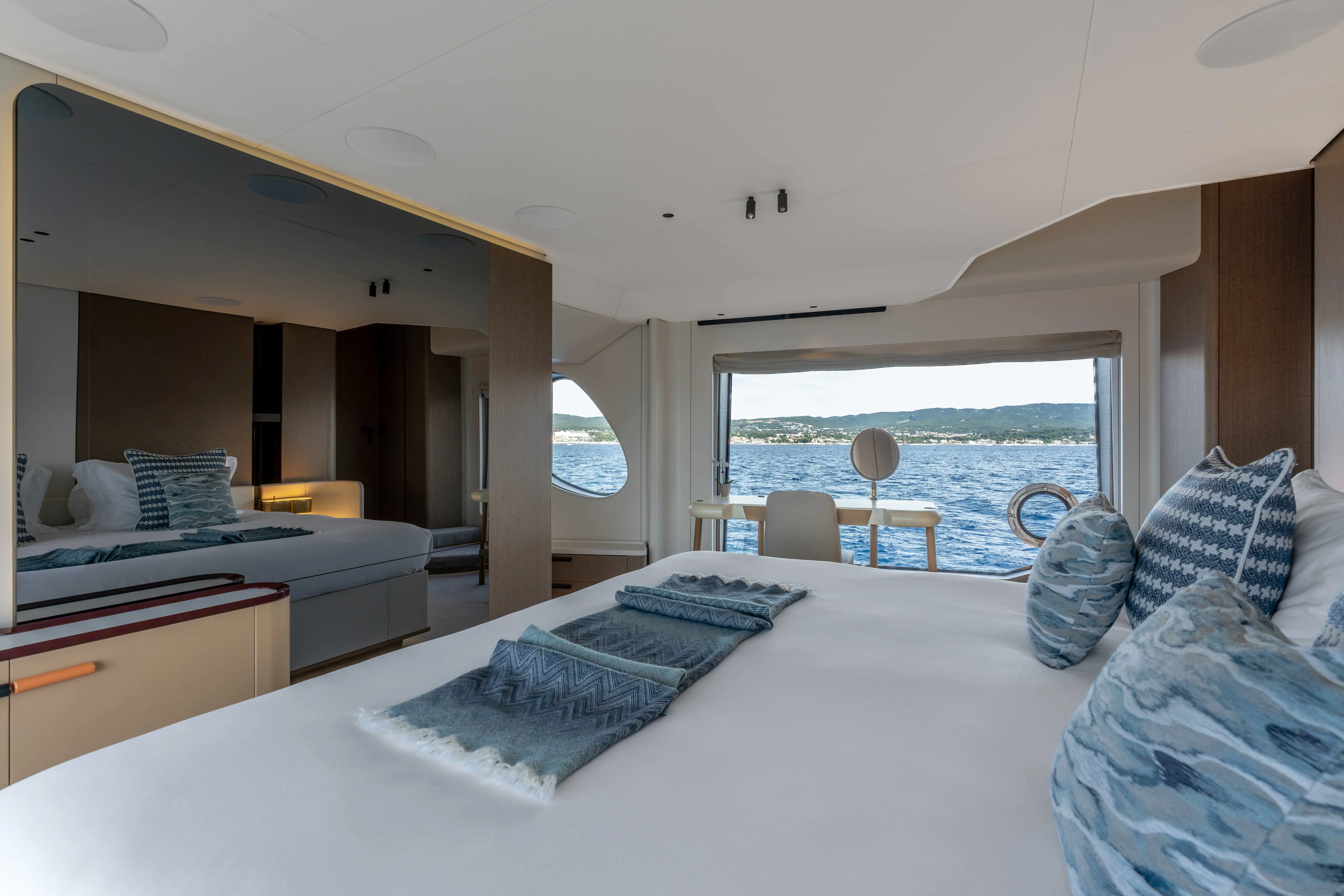 a room with a bed and a chair aboard ST JUDE Yacht for Sale