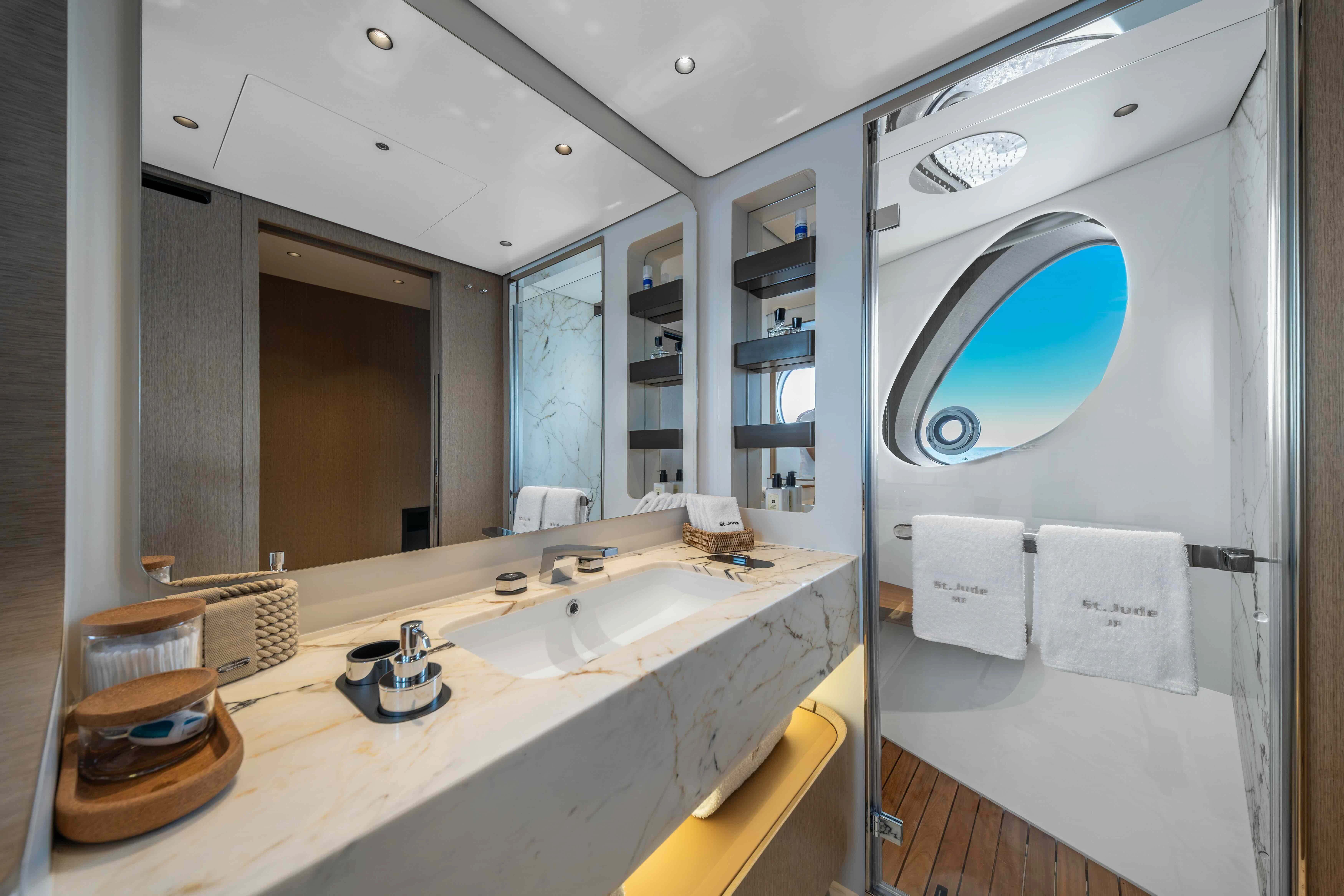 a bathroom with a large mirror aboard ST JUDE Yacht for Sale