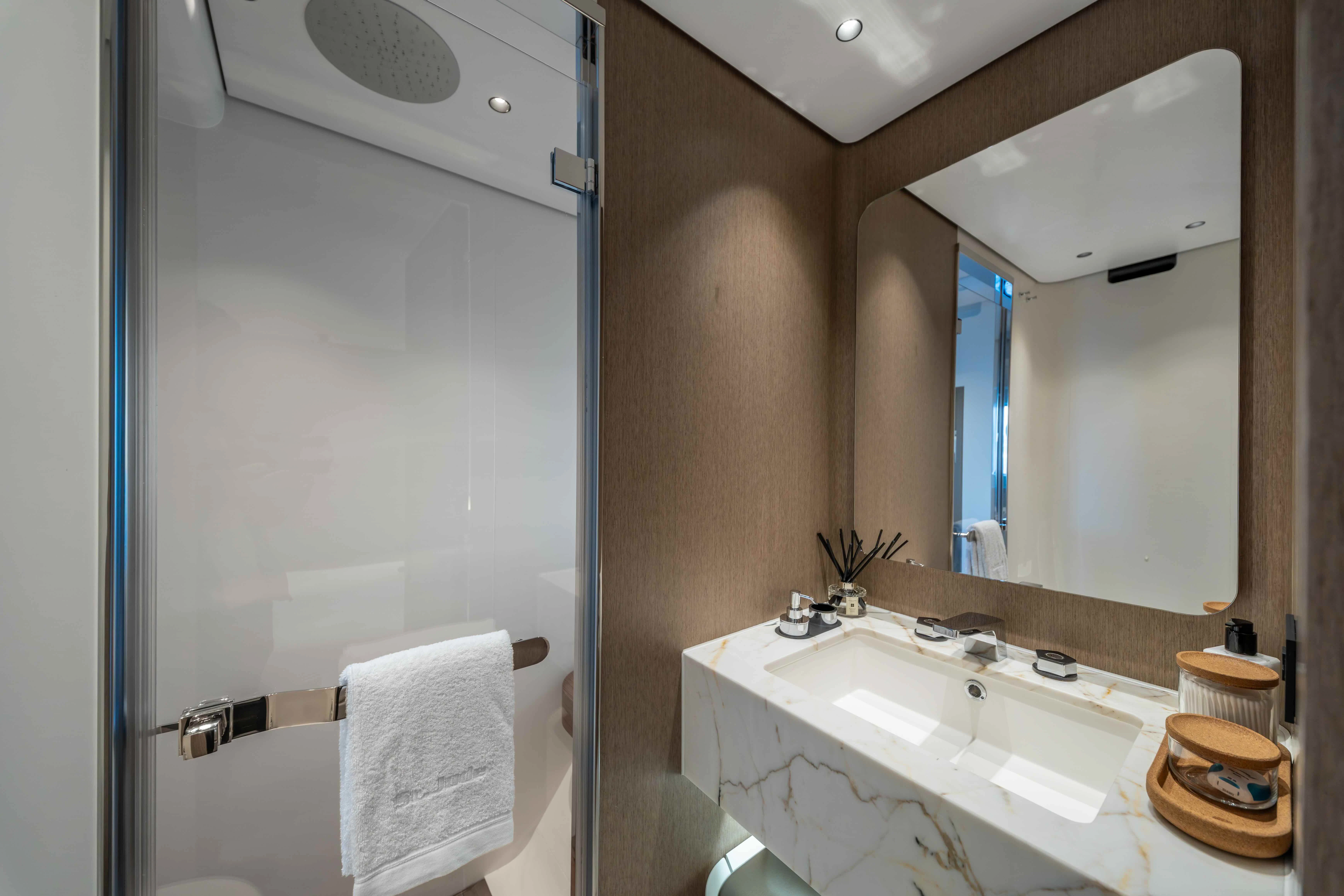 a bathroom with a large mirror aboard ST JUDE Yacht for Sale