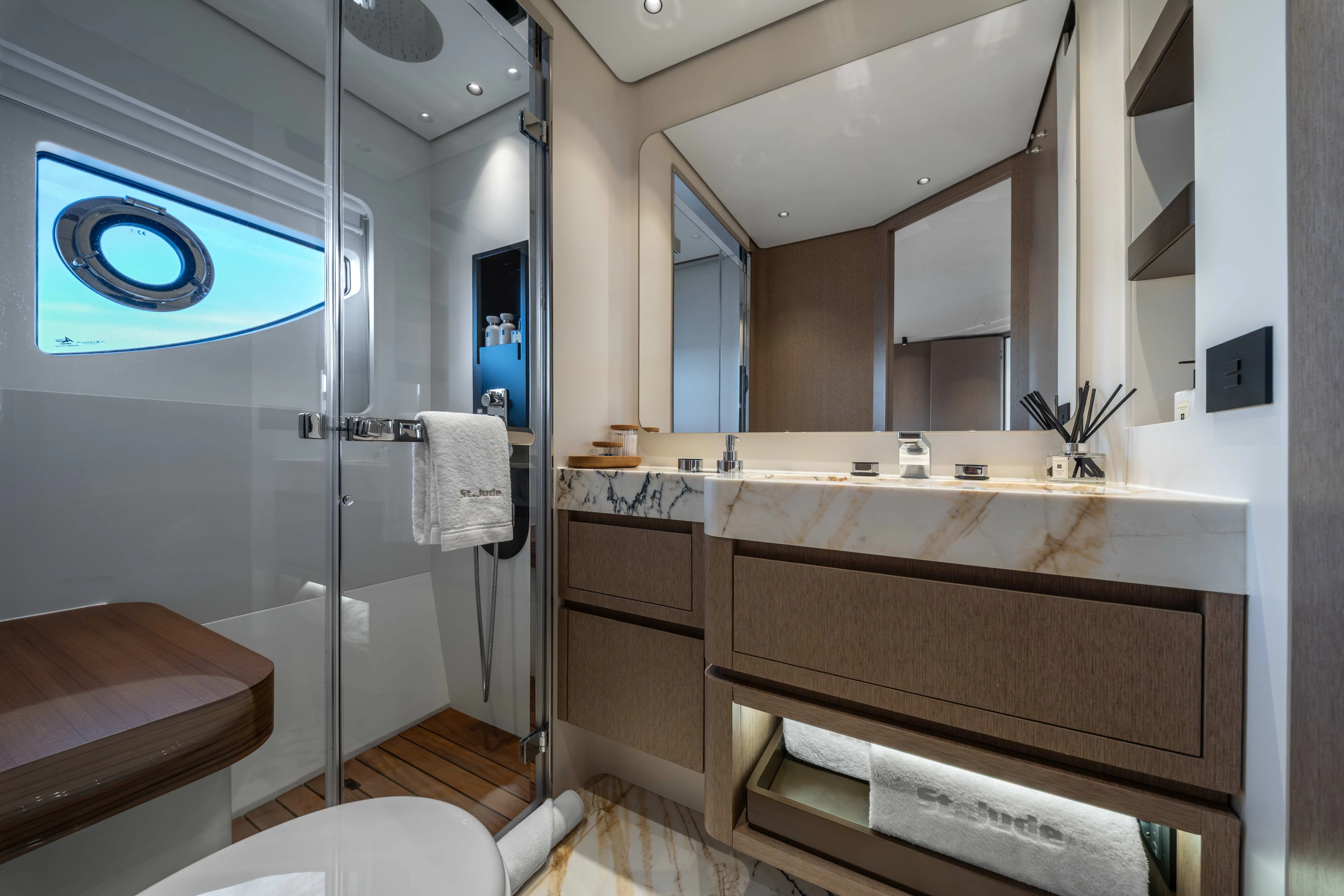 a bathroom with a glass shower aboard ST JUDE Yacht for Sale