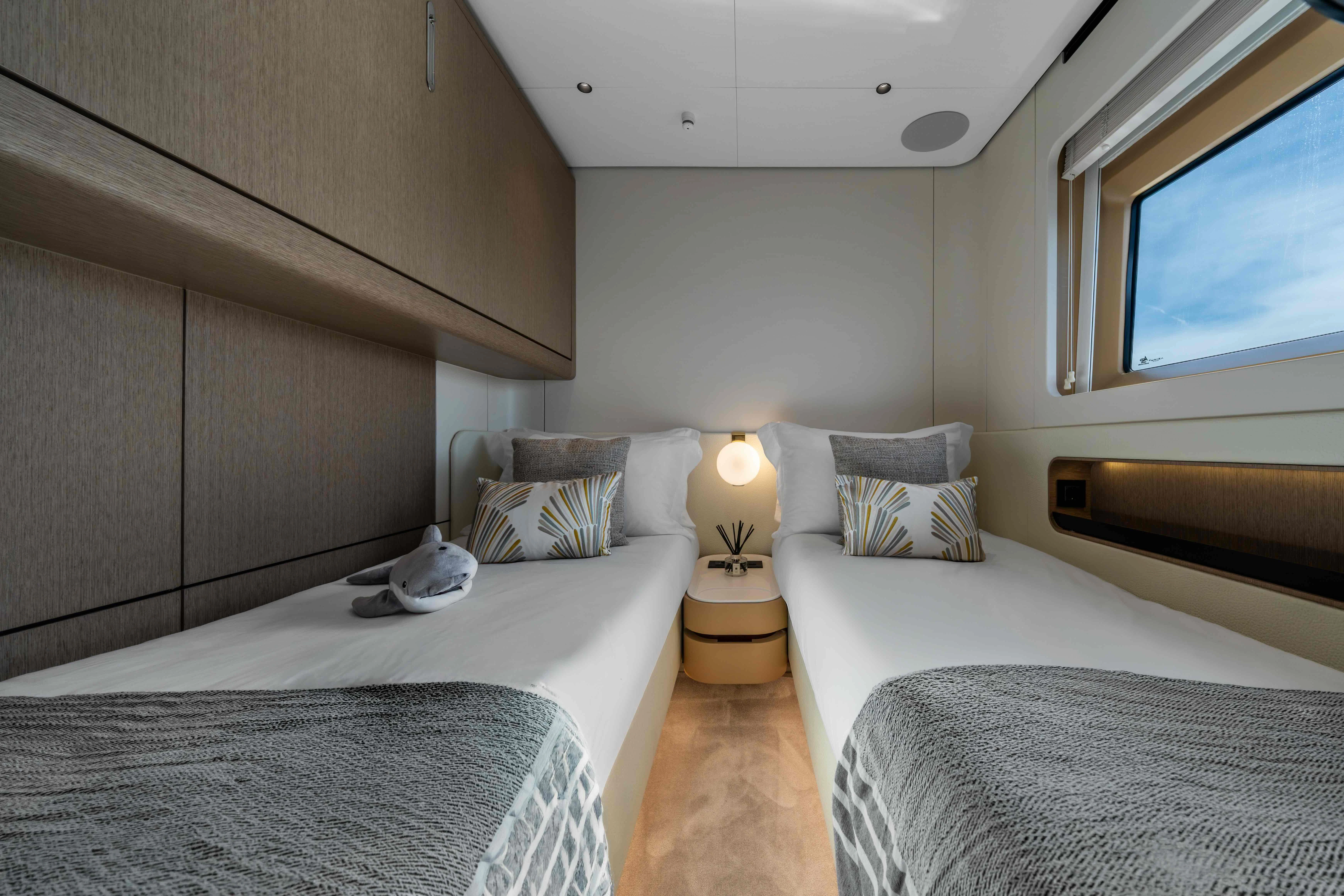 a room with two beds aboard ST JUDE Yacht for Sale