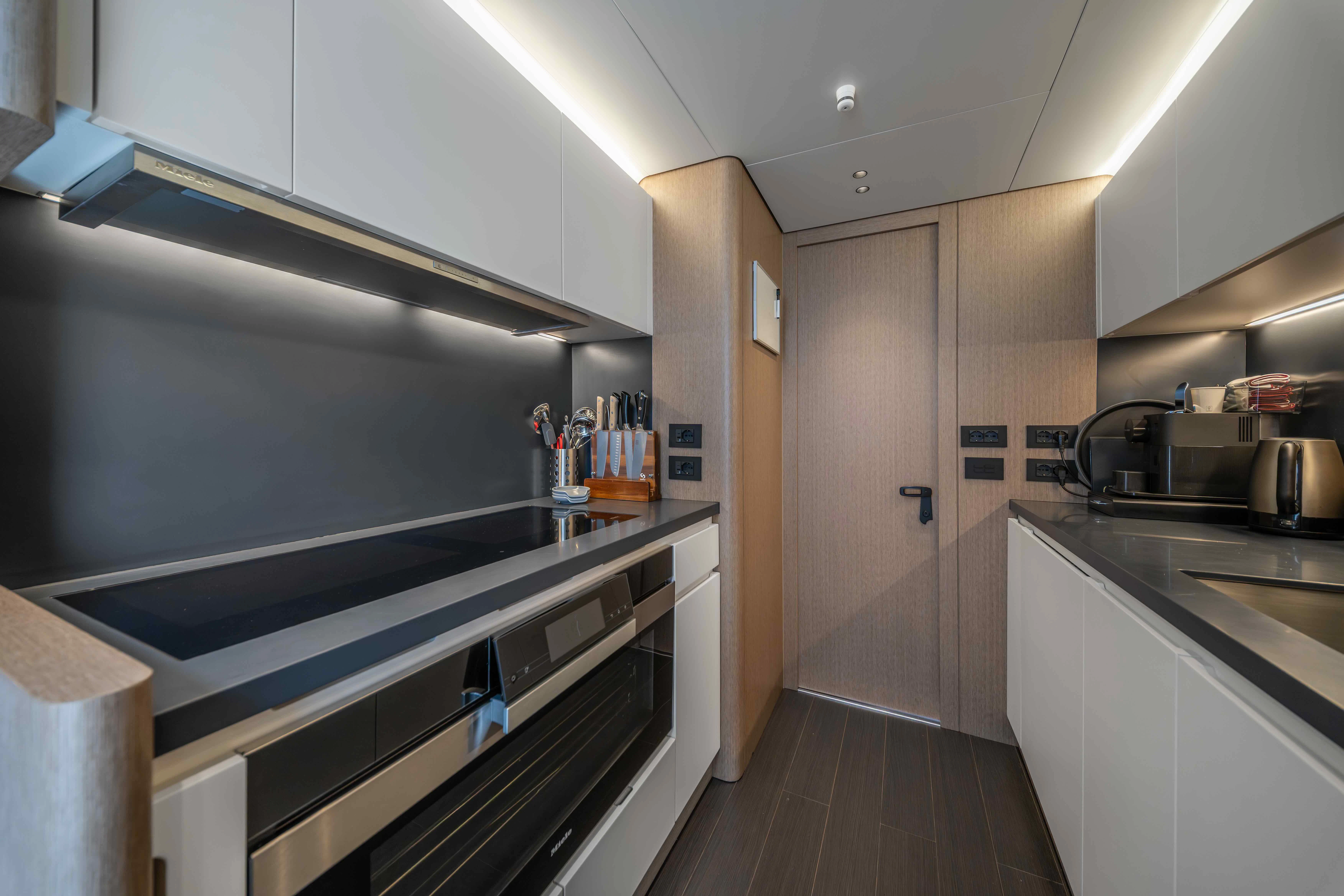 a kitchen with a stainless steel stove aboard ST JUDE Yacht for Sale