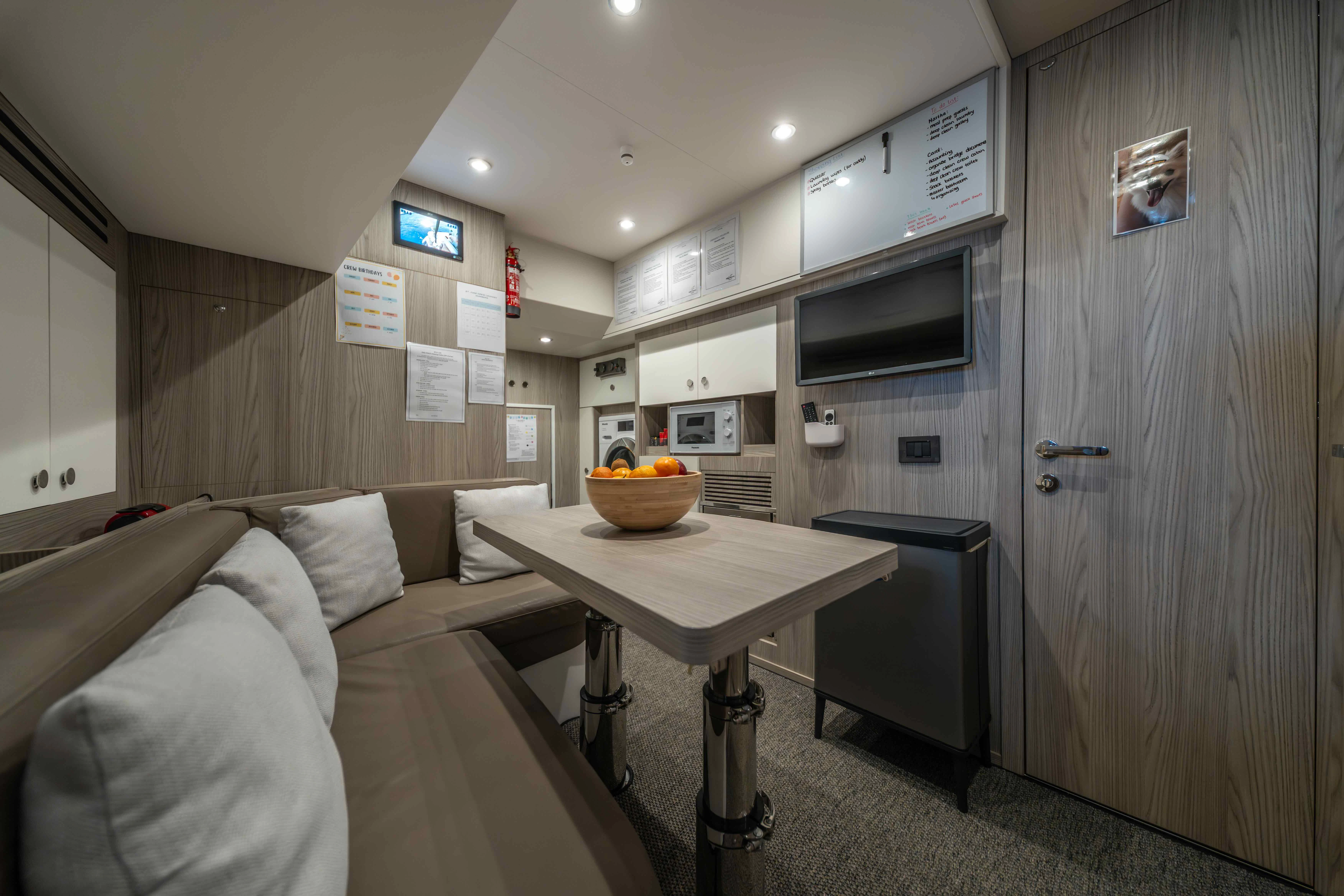 a room with a couch and a table aboard ST JUDE Yacht for Sale