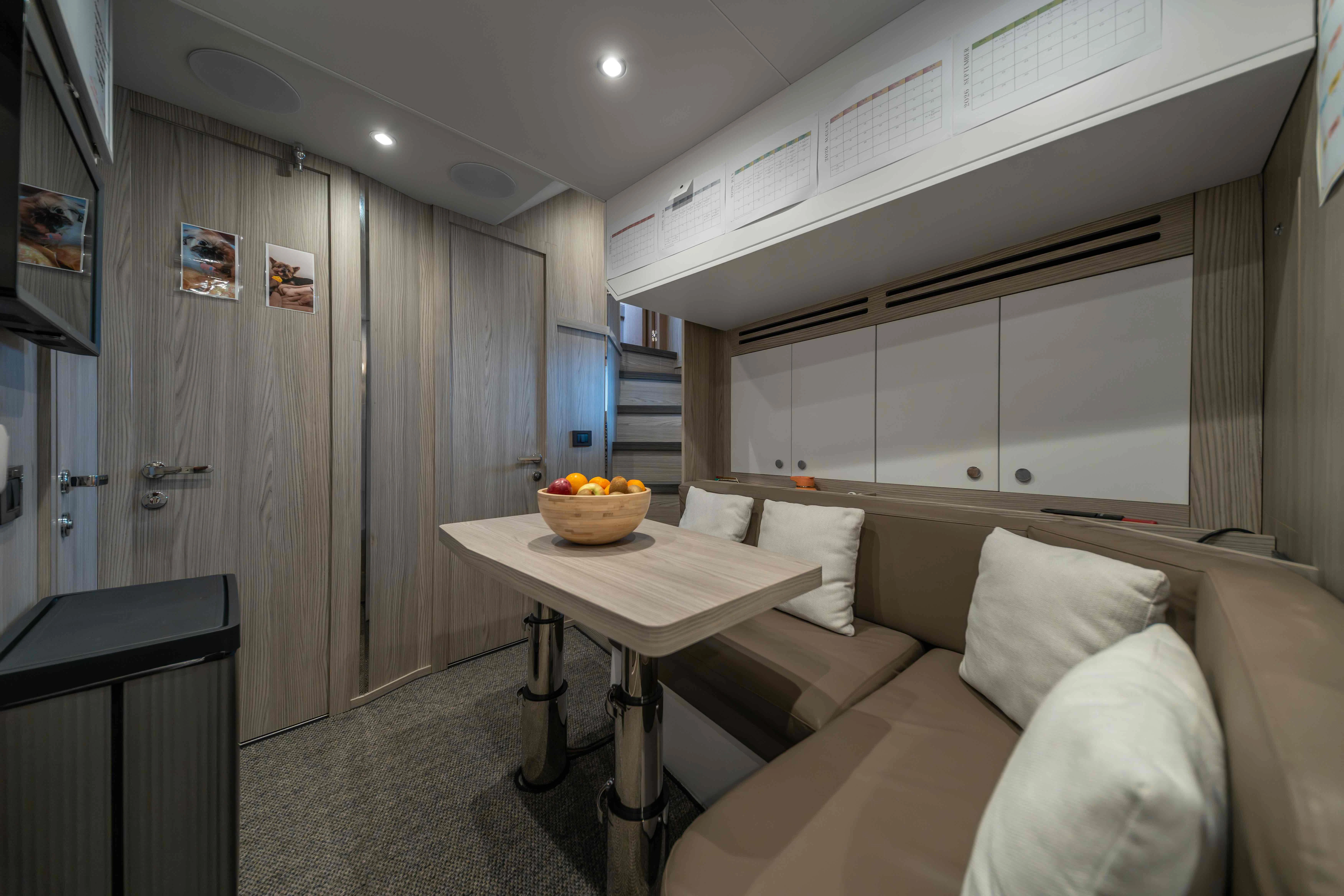 a room with a couch and a table aboard ST JUDE Yacht for Sale