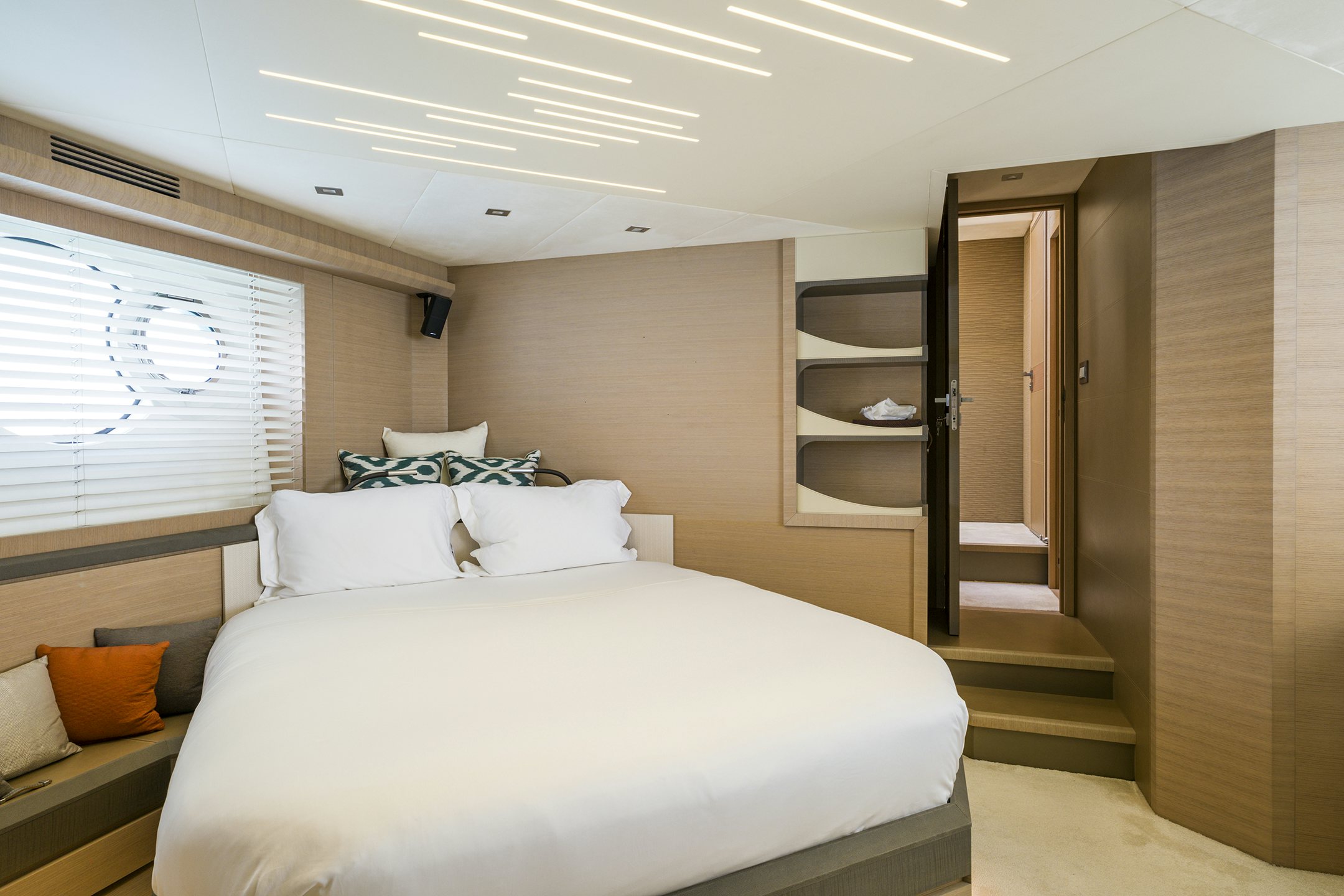 a bedroom with a bed and a closet aboard CRAZY DIAMOND Yacht for Sale