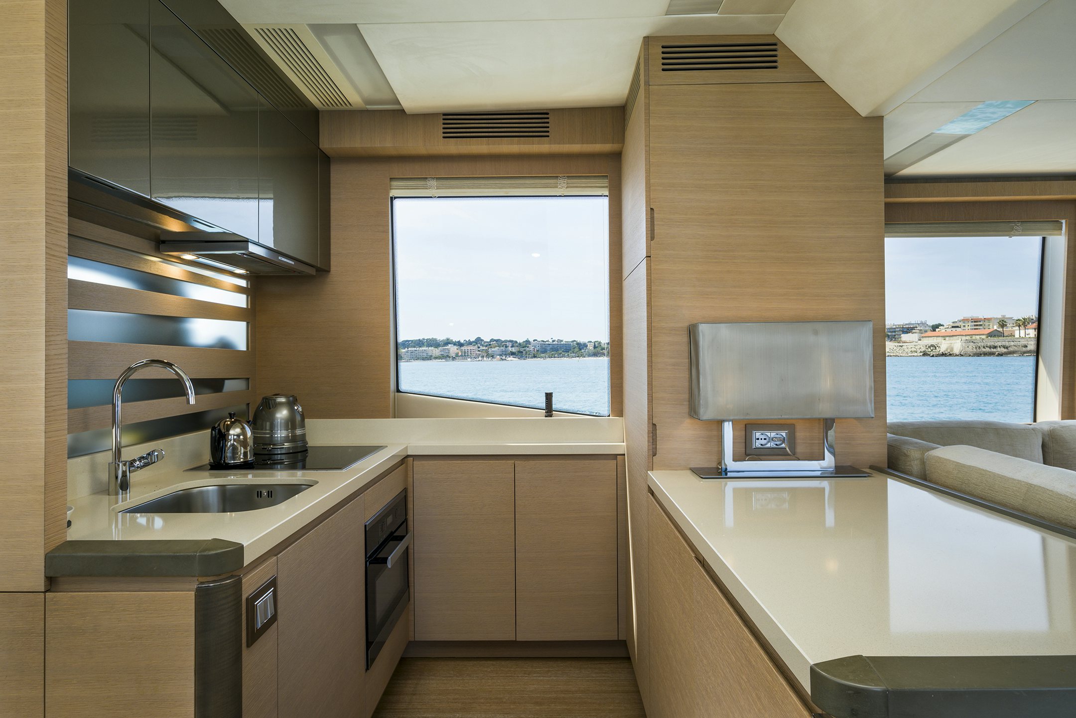 a kitchen with a sink and a tv aboard CRAZY DIAMOND Yacht for Sale