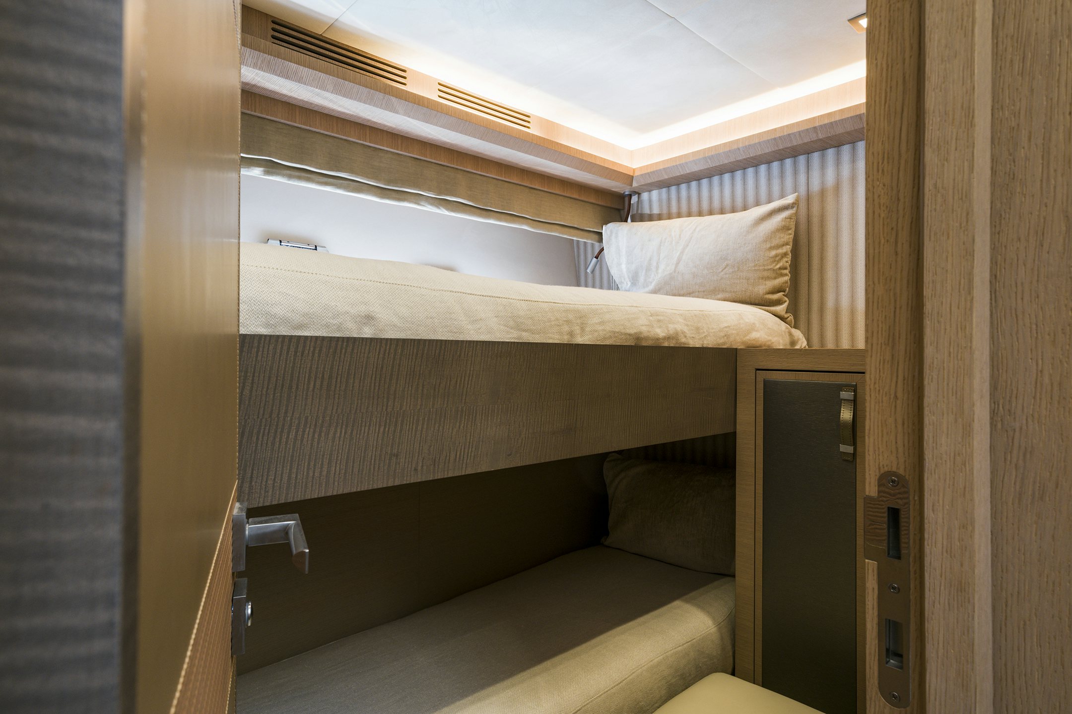 a bed with a wooden frame aboard CRAZY DIAMOND Yacht for Sale
