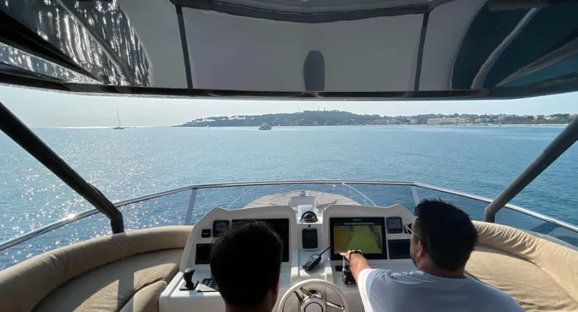a man driving a boat aboard CRAZY DIAMOND Yacht for Sale