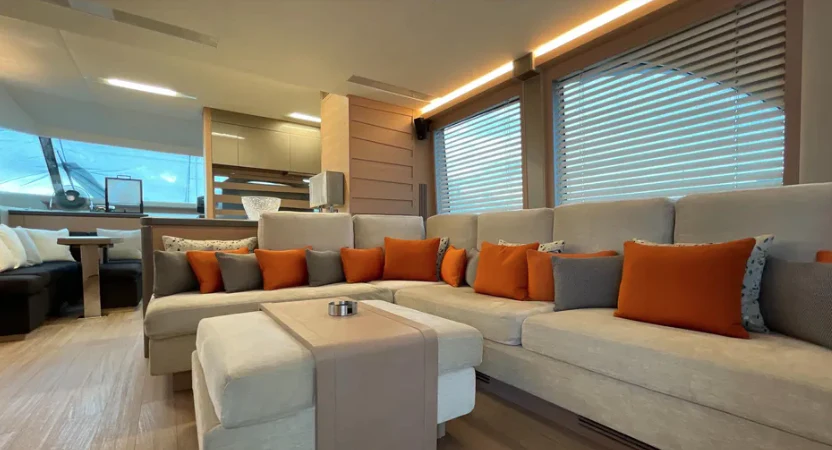 a living room with a couch and a table aboard CRAZY DIAMOND Yacht for Sale