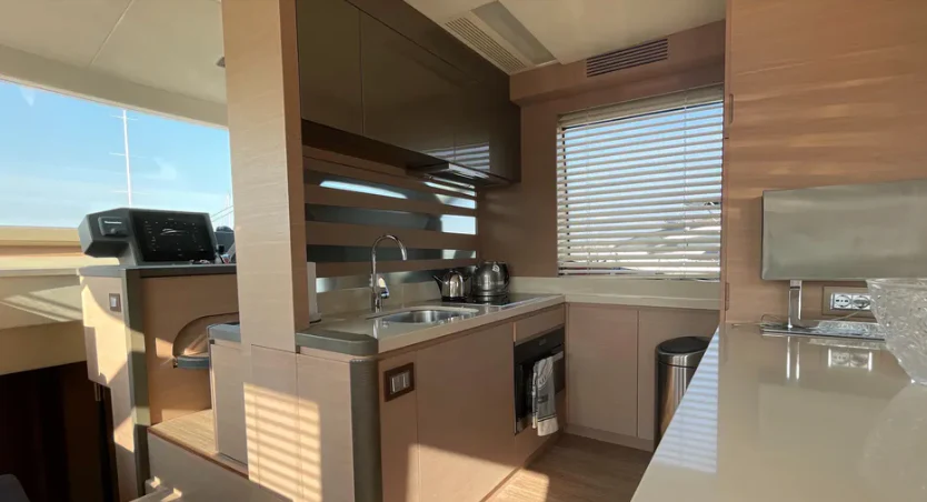 a kitchen with a sink and a microwave aboard CRAZY DIAMOND Yacht for Sale