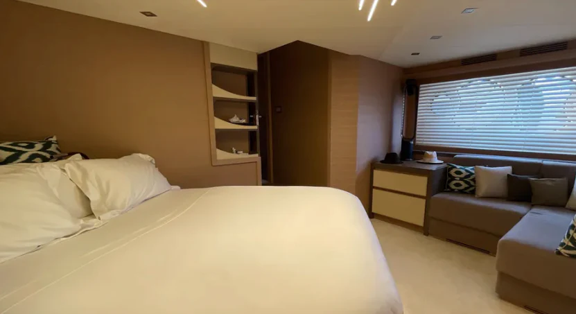 a room with a bed and a couch aboard CRAZY DIAMOND Yacht for Sale