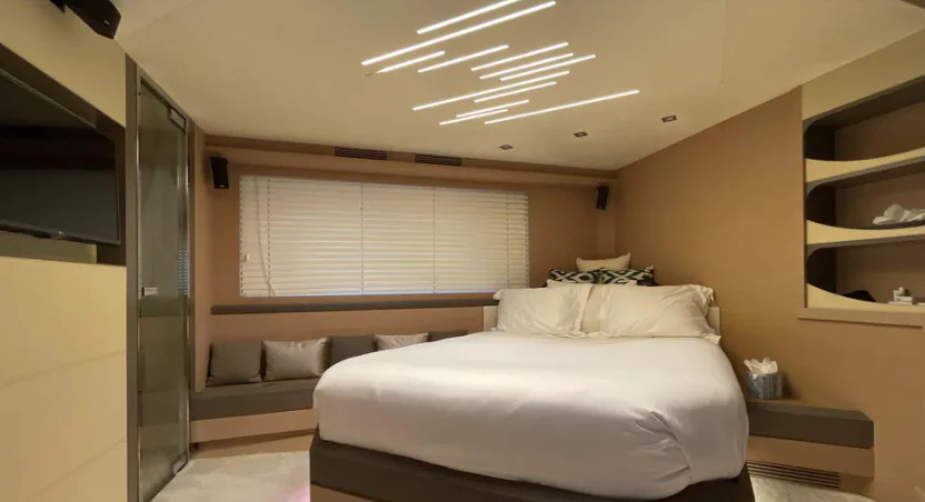 a room with a bed and a window aboard CRAZY DIAMOND Yacht for Sale